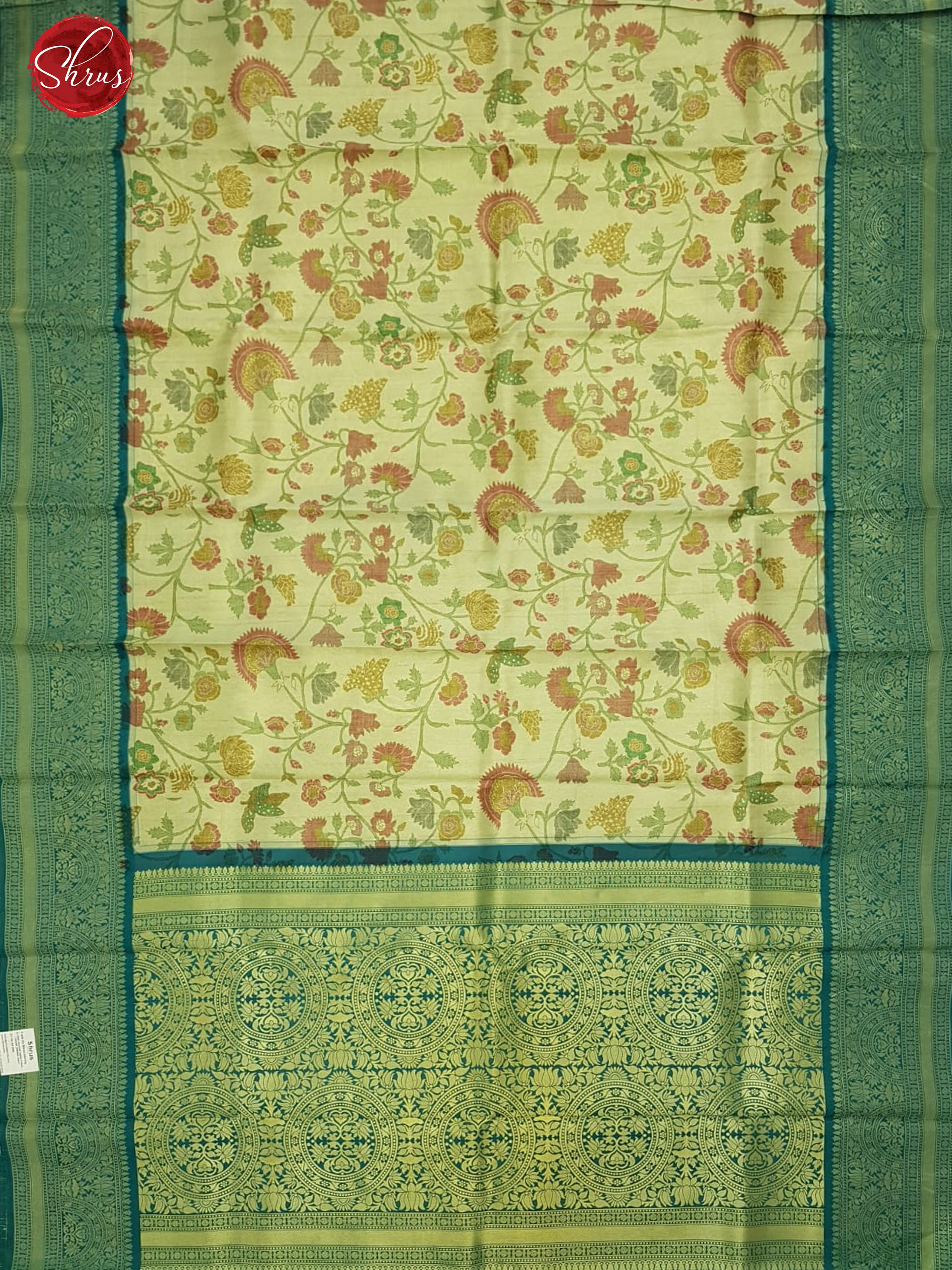 Beige & Green - Semi Kanchipuram Silk with thread woven floral nestling on the body & contrast zari border - Shop on ShrusEternity.com