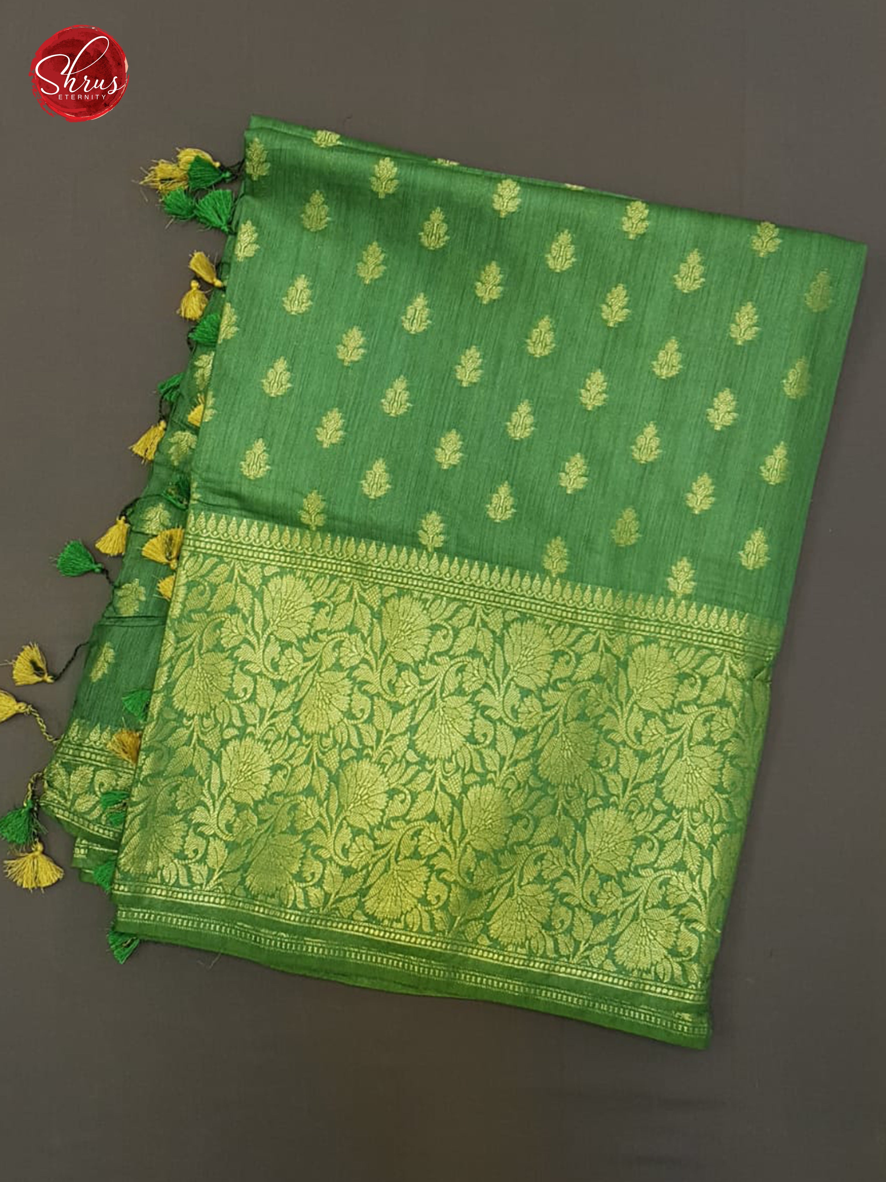 Green(Single Tone)- Tussar with zari woven floral buttas on the body & Zari Border