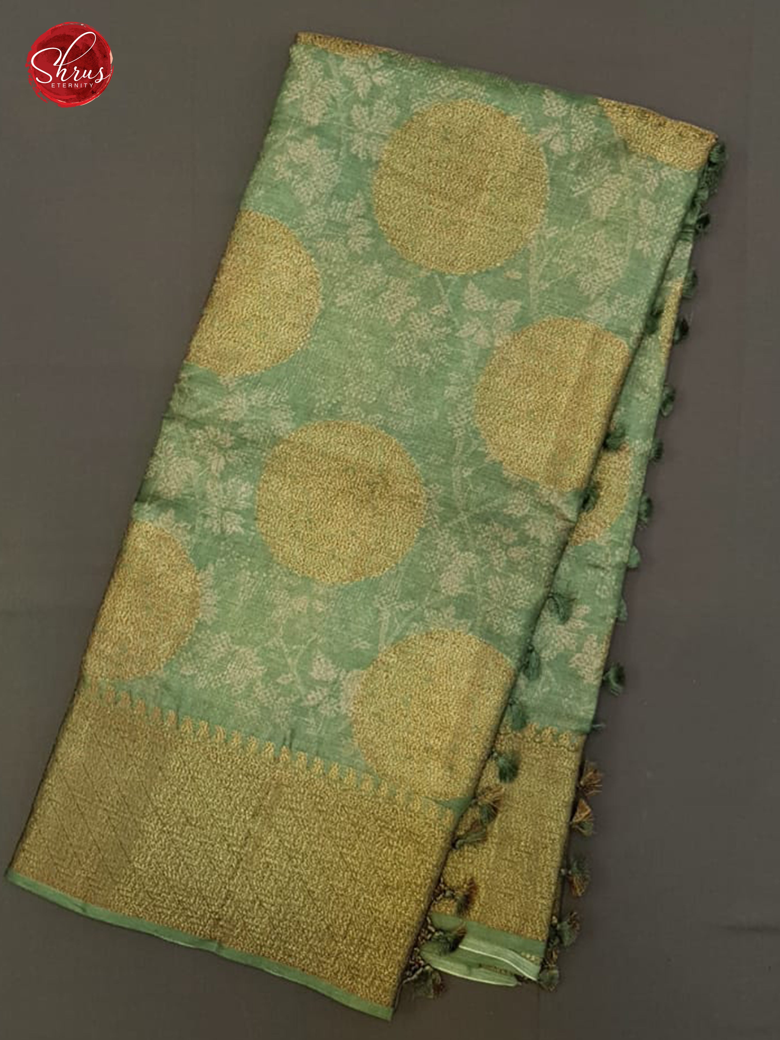 Green(Single Tone)- Tussar with zari woven floral motifs , floral print on the body & Zari Border - Shop on ShrusEternity.com