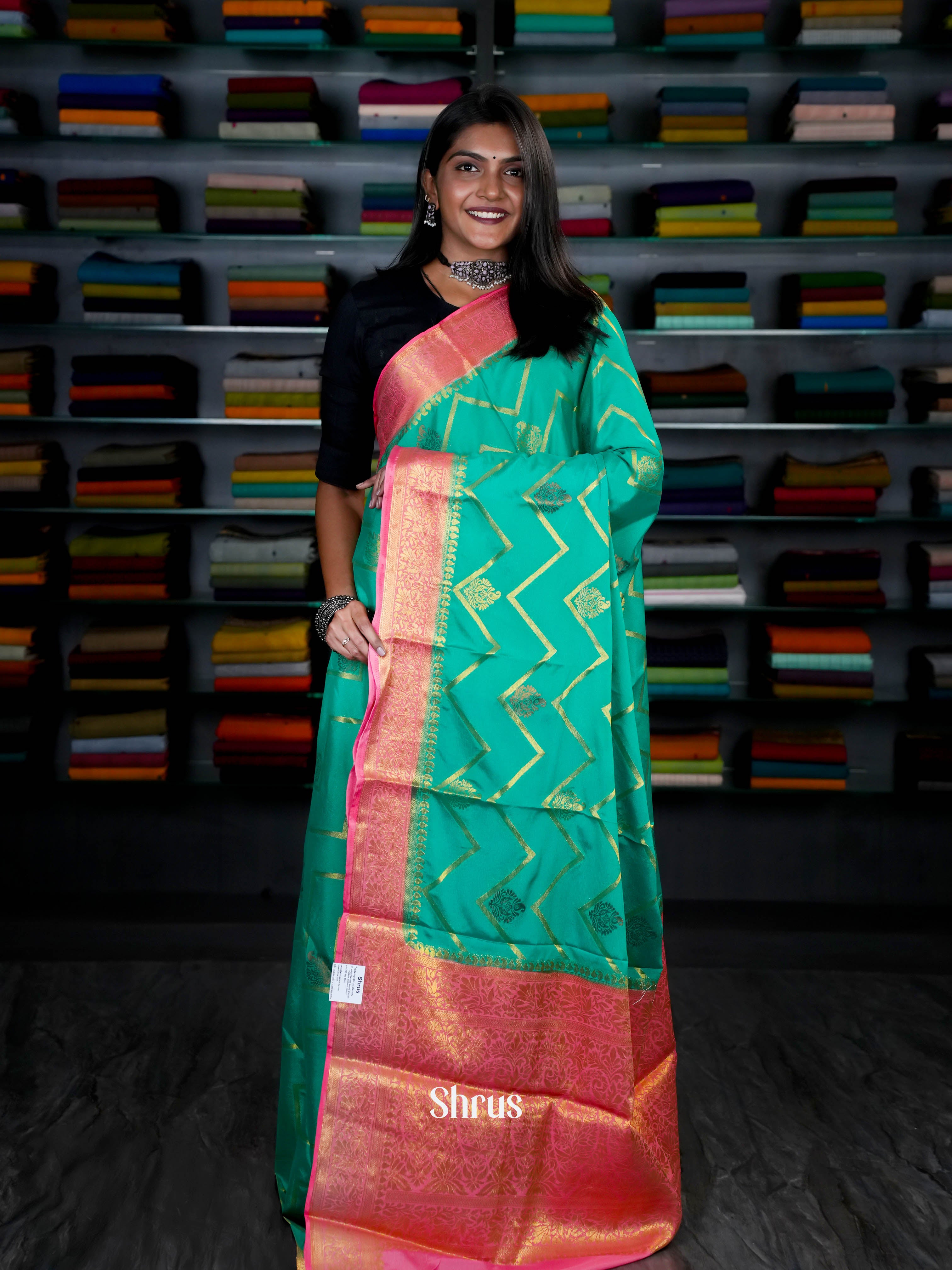 Green & Pink- Semi Mysore Silk with Zari woven floral motifs , wavy Stripes on the body & Gold Zari Border