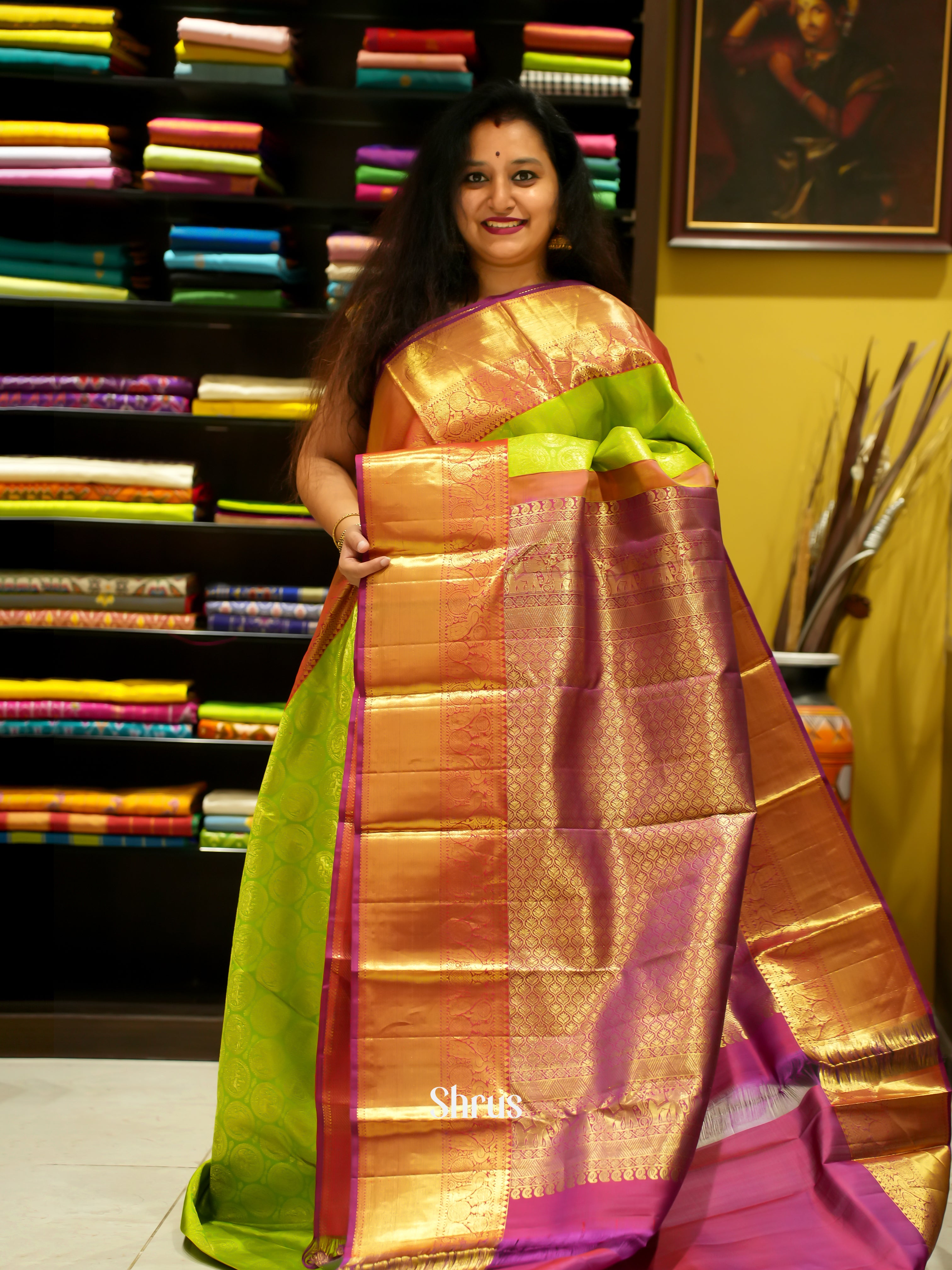 Parrot Green & Majenta - Korvai Kanchipuram Silk with zari woven elephant ,peacock motifs on the body & Zari Border