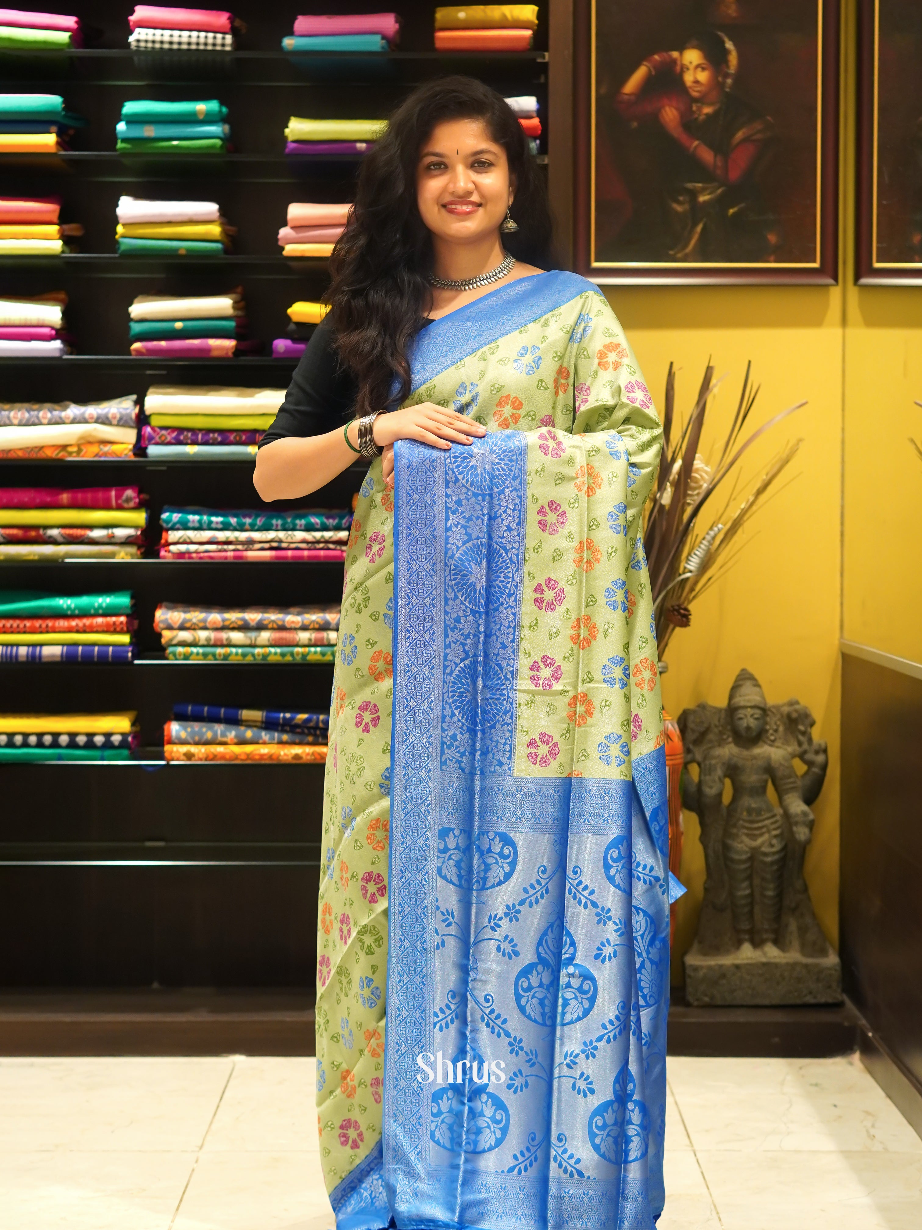 Green & Blue - Semi Georgette with floral print on the body & Contrast Zari Border