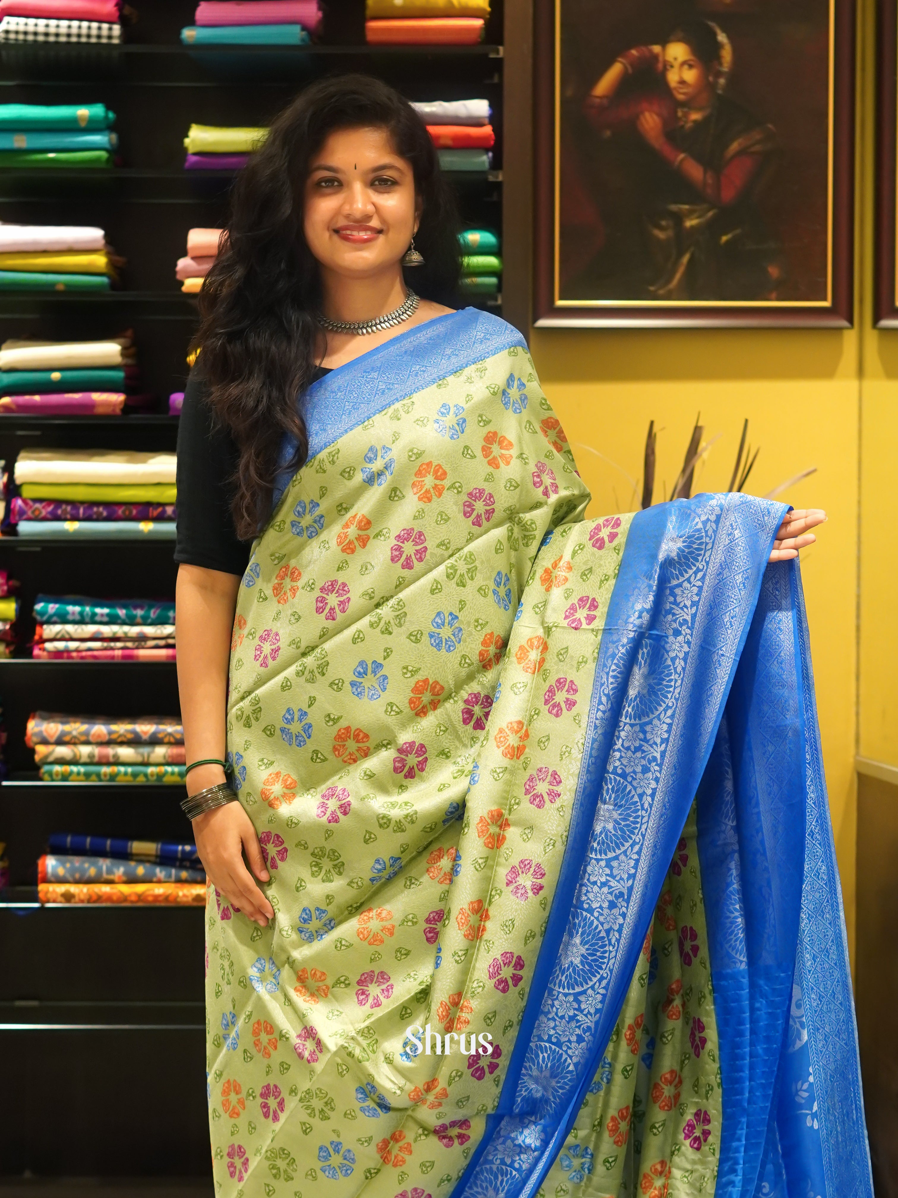 Green & Blue - Semi Georgette with floral print on the body & Contrast Zari Border