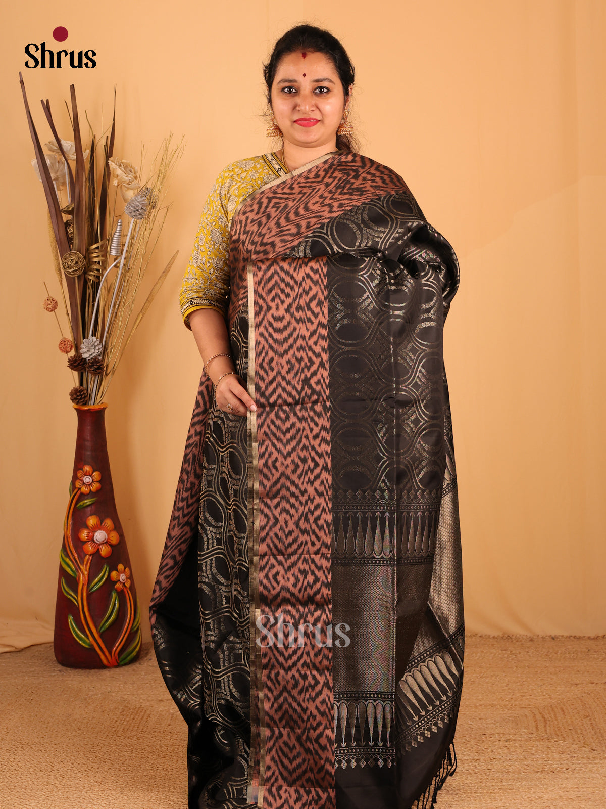 Mesmerizing Black Soft Silk Saree With Zari Woven Body, Brown Ikkat Border & Brocade Pallu