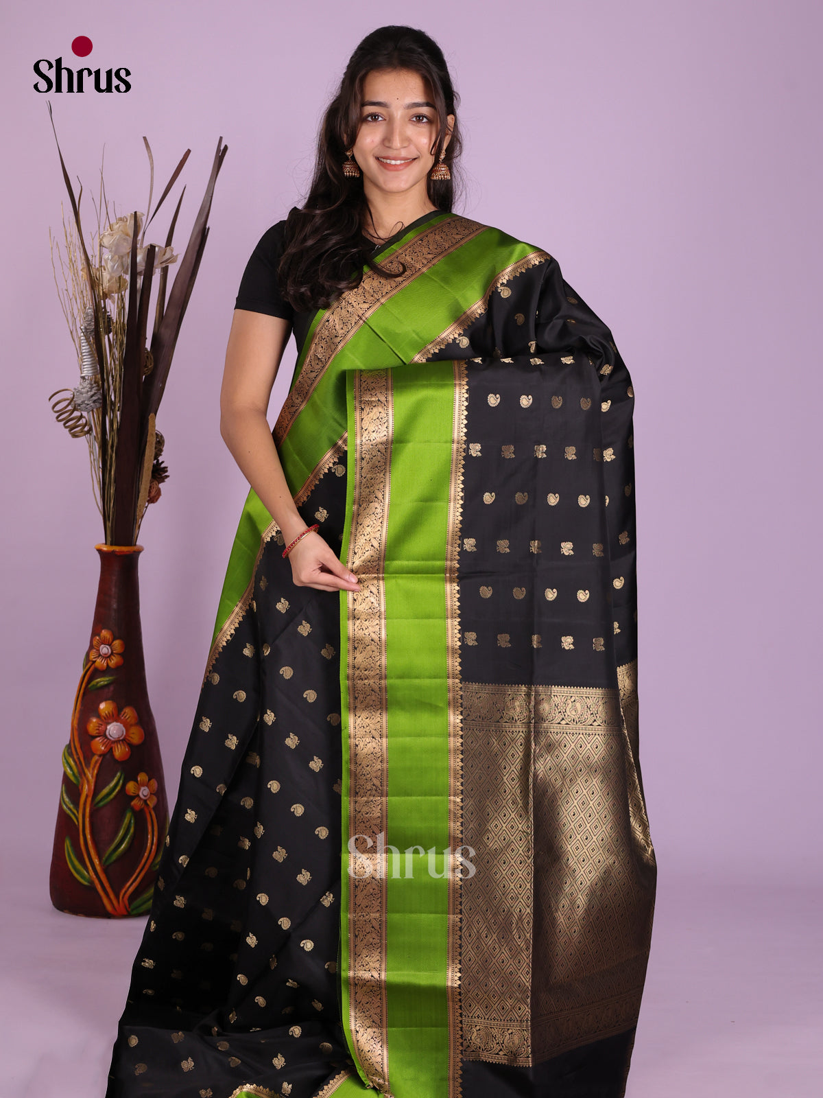Mystique Black Soft Silk Saree with Manga & Peacock Buttas And Light Green Rettaipet Border