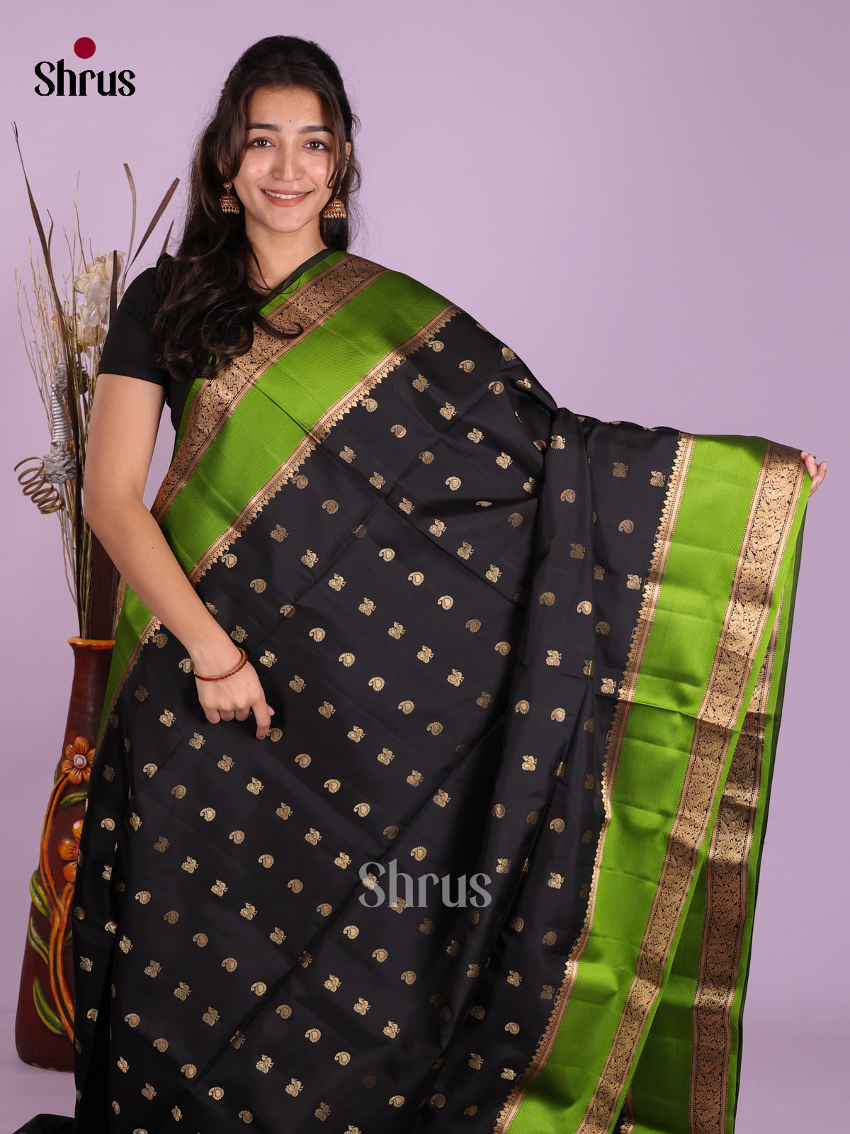 Mystique Black Soft Silk Sarees with Manga & Peacock Buttas And Light Green Rettaipet Border
