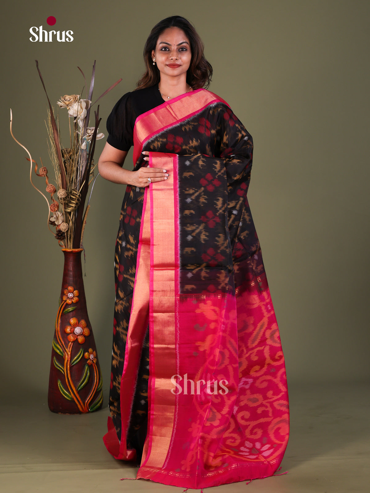 Bold Black Pochampally Silk Cotton Saree With Elephant Prints & Pink Kaddi Border