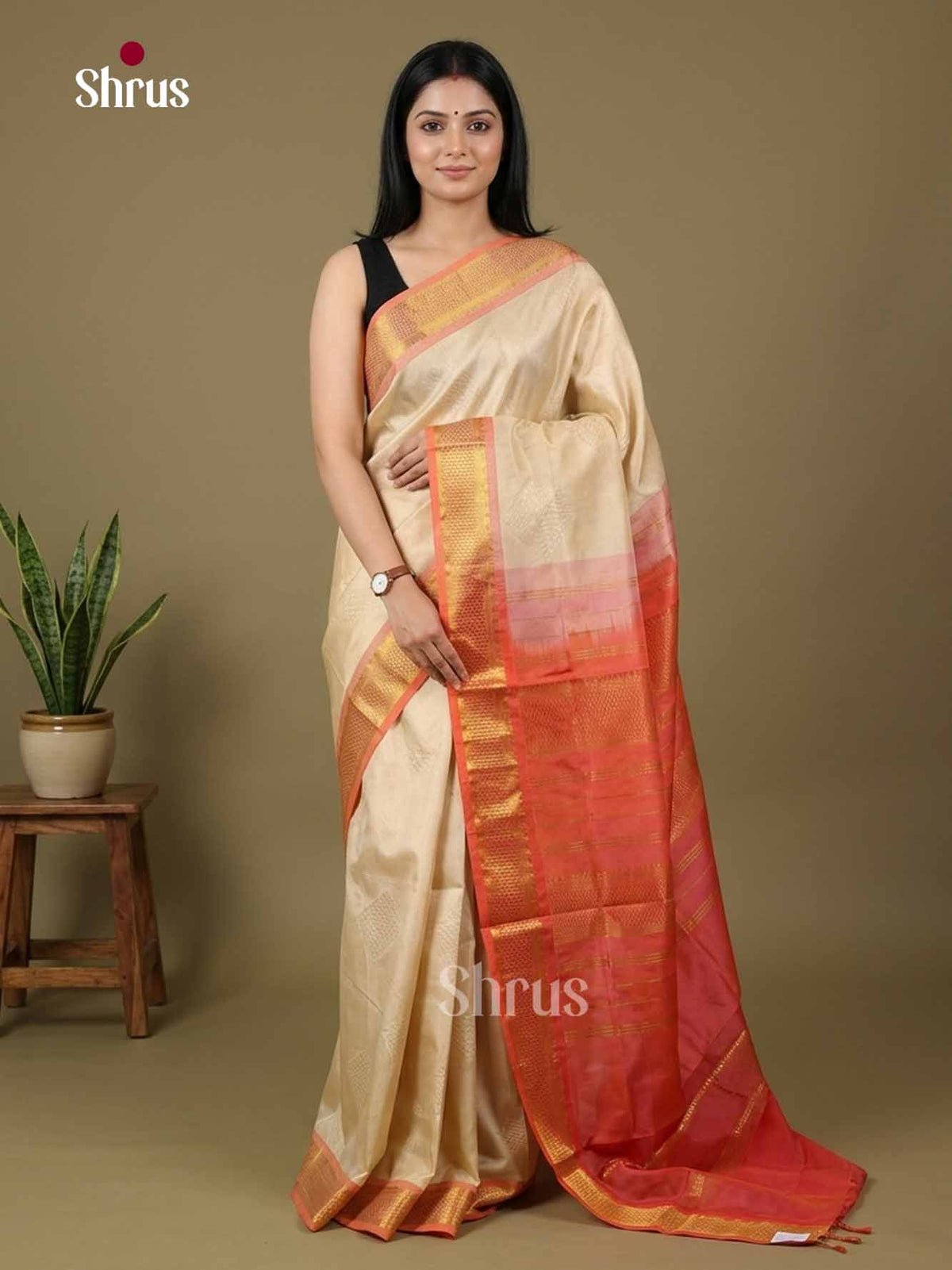 Classic Champagne Gold Cotton Silk Saree With Subtle Geometric Motifs & Coral Pink Traditional Zari pallu