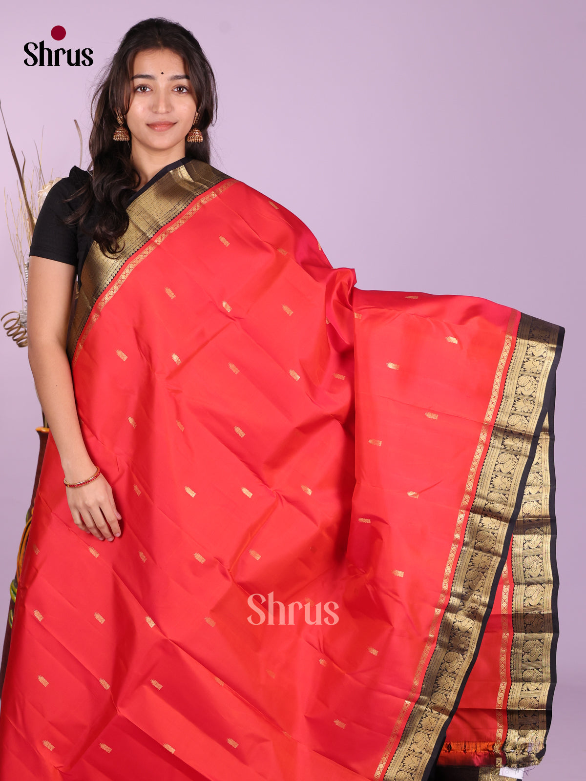 Buy Ravishing Coral Red Kanchipuram Saree With Zari Buttas, Black Border & Brocade Pallu