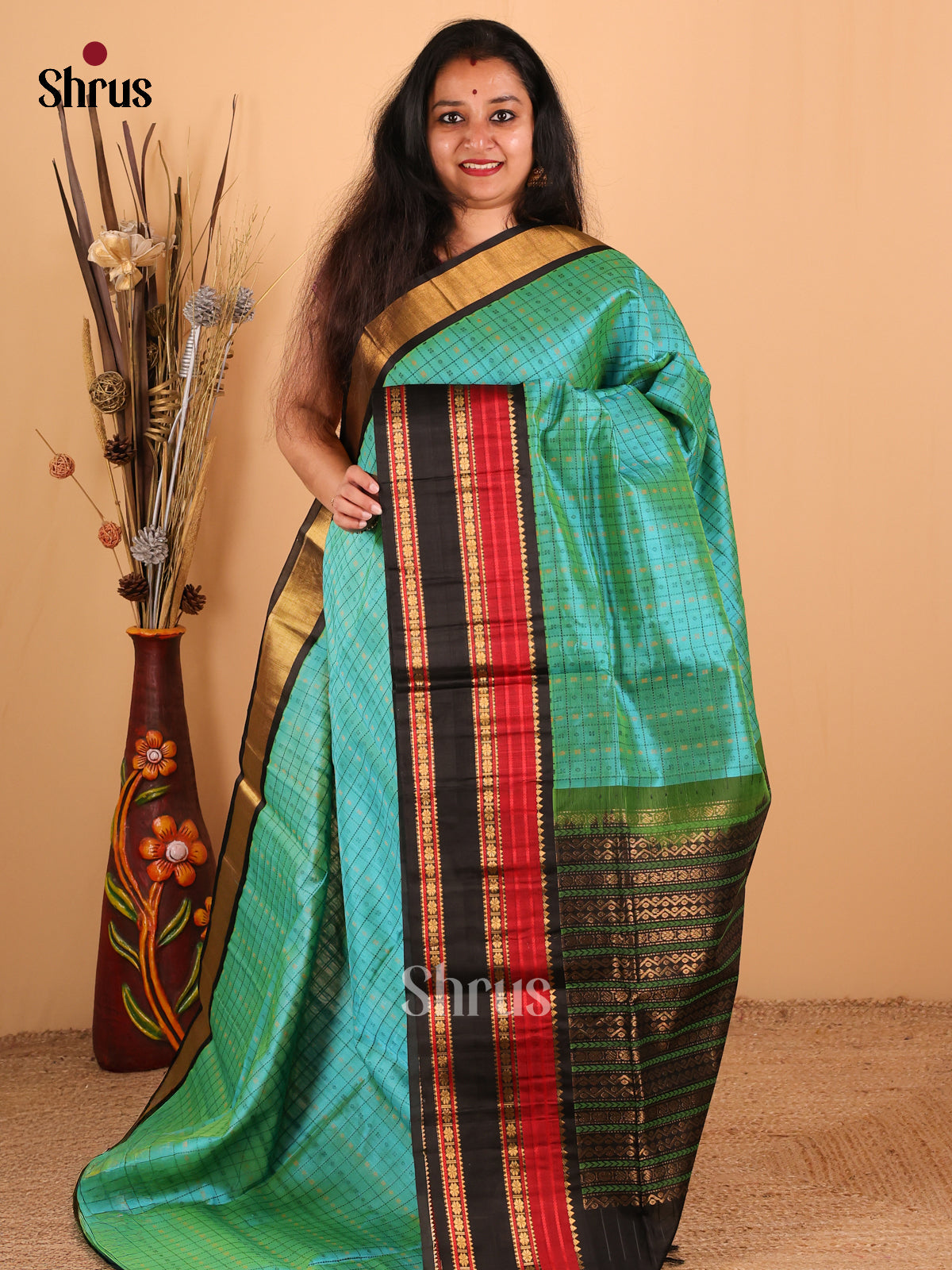 Chic Teal Green And Black Silk Cotton Saree With Beautifully Woven Checks and Buttas Across The Body And Rettaipet Border - Shop on Shrus.com