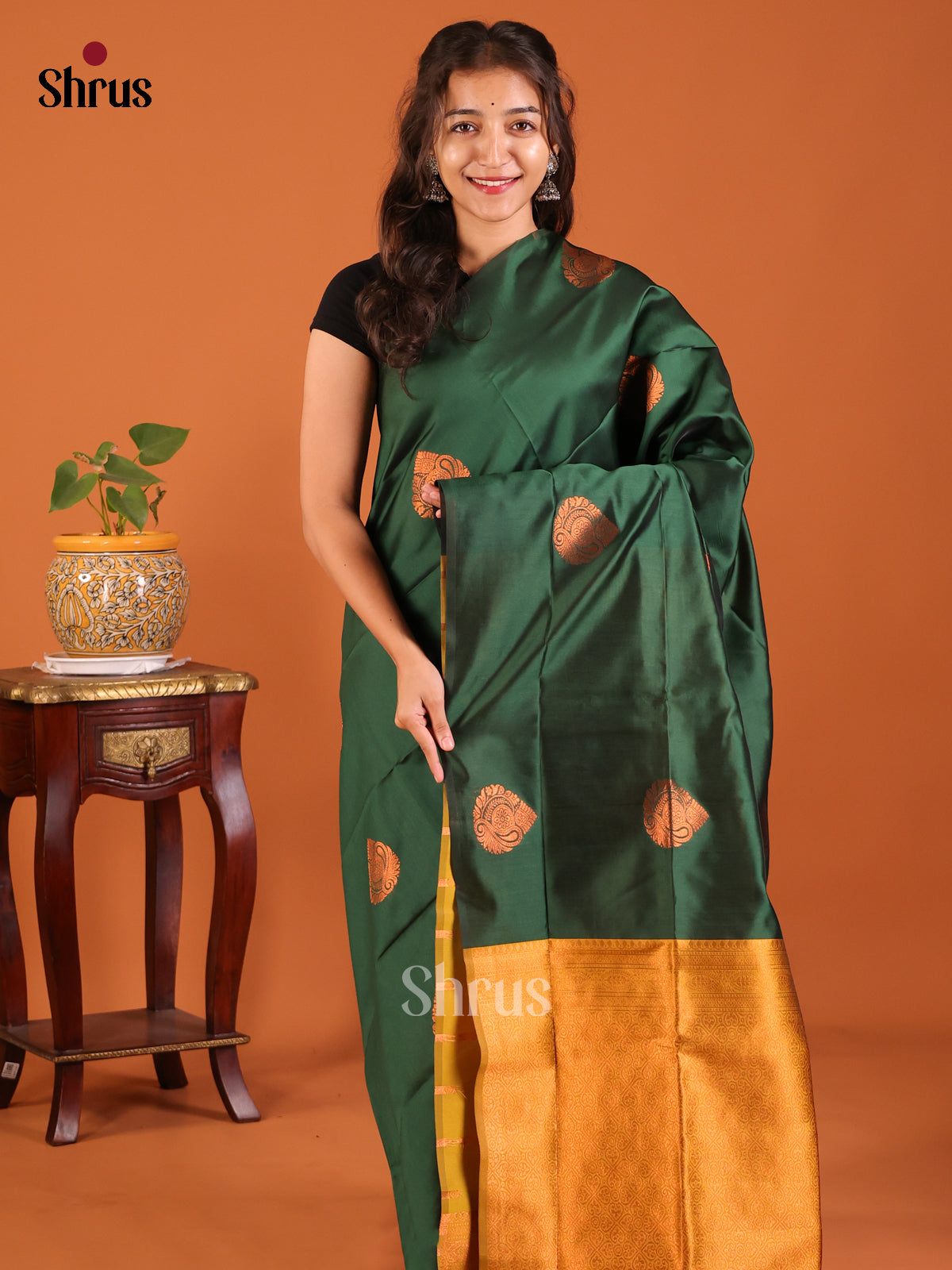 Graceful Bottle Green Semisoft silk Saree with zari woven floral drop motifs , zari butta Blouse - Shop on Shrus.com