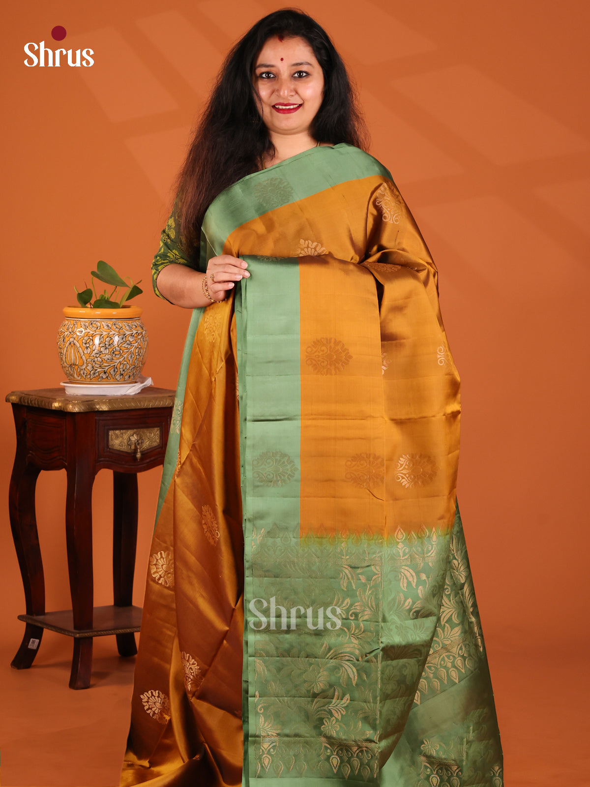 Shimmery Mustard Softsilk-halfpure Saree dazzles with floral motifs , brocade pallu - Shop on Shrus.com