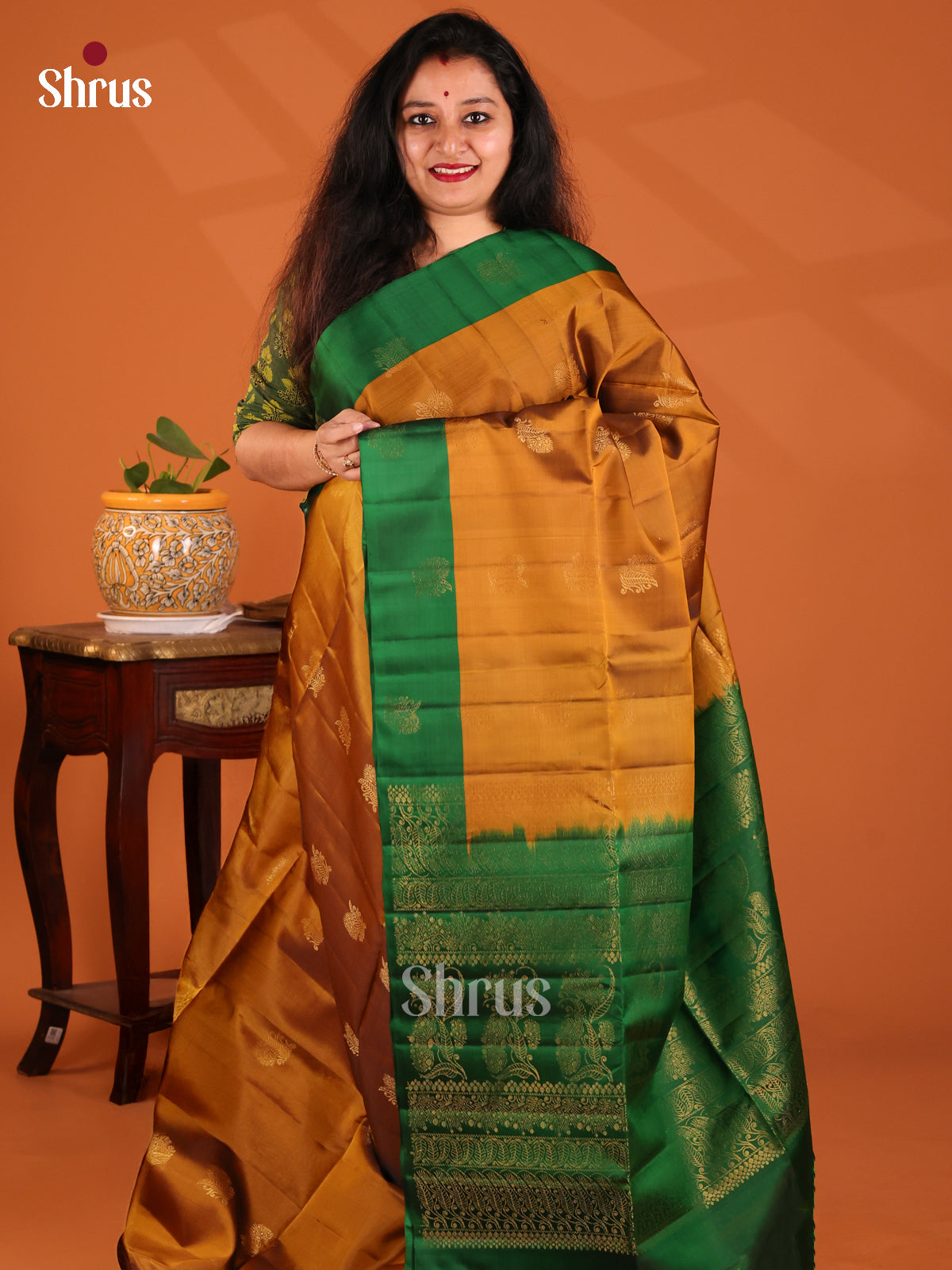 Dazzling Mustard Softsilk-halfpure Saree shines with zari buttas , green brocade pallu - Shop on Shrus.com