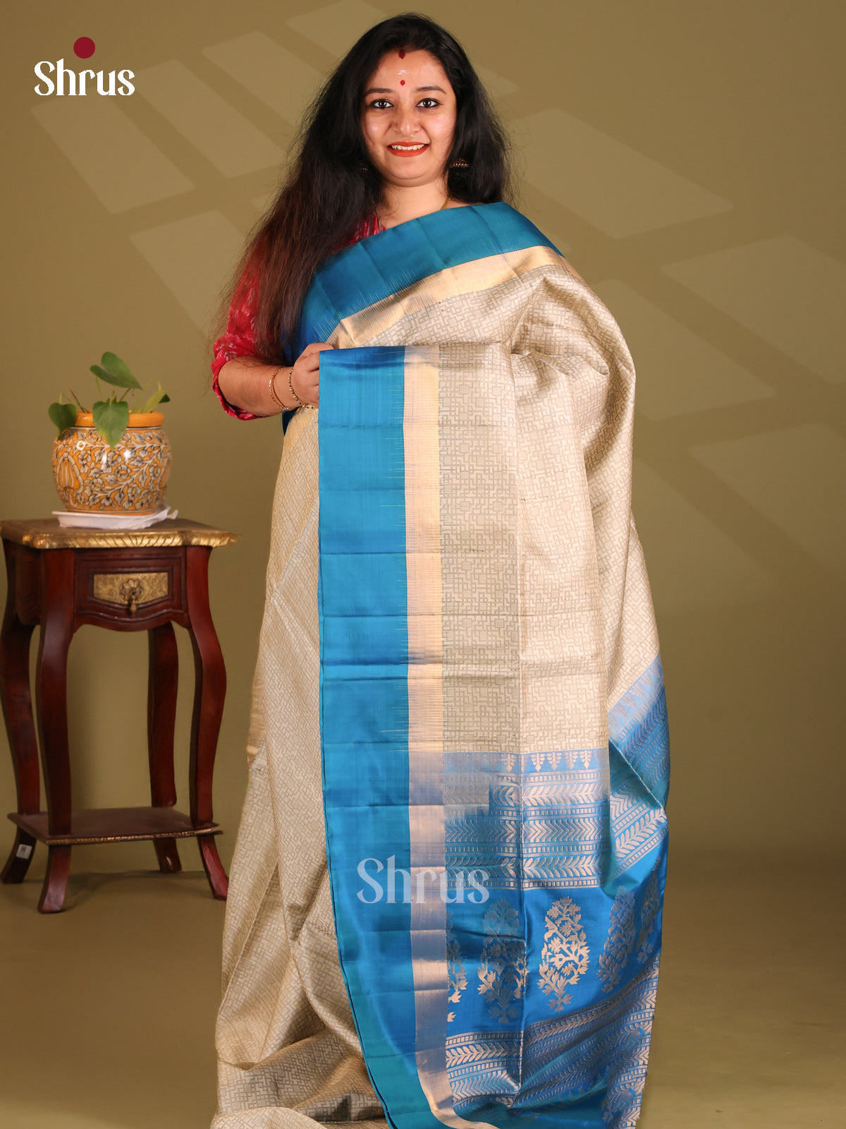 Charming Cream Soft Silk Saree with geometric woven body , contrast blue zari pallu - Shop on Shrus.com