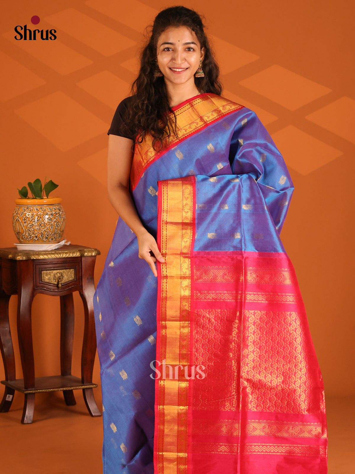 Vibrant Blue Silk Cotton Saree gleams with gold zari peacock buttas & contrast zari border - Shop on Shrus.com