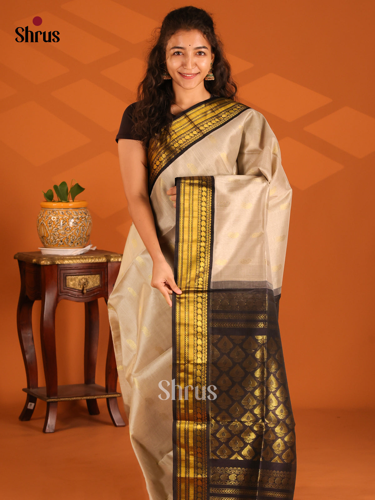 Charming Cream Silk Cotton Saree with gold zari paisleys buttas & black zari border - Shop on Shrus.com