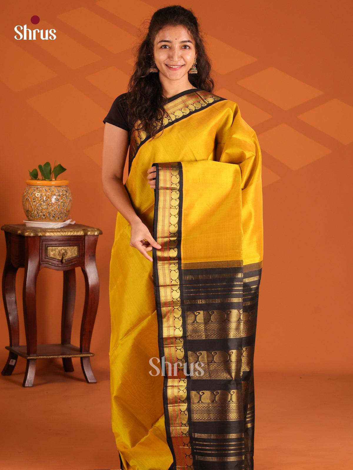 Dazzling Yellow  Silk Cotton Saree with zari woven manga buttas in black border - Shop on Shrus.com