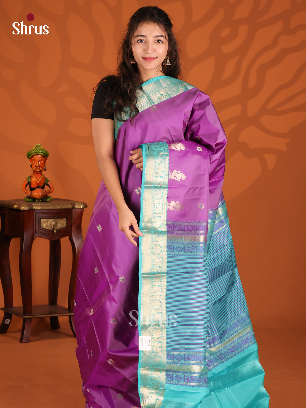 Purple & Teal Kanchipuram silk Saree gleams with zari peacock buttas-1