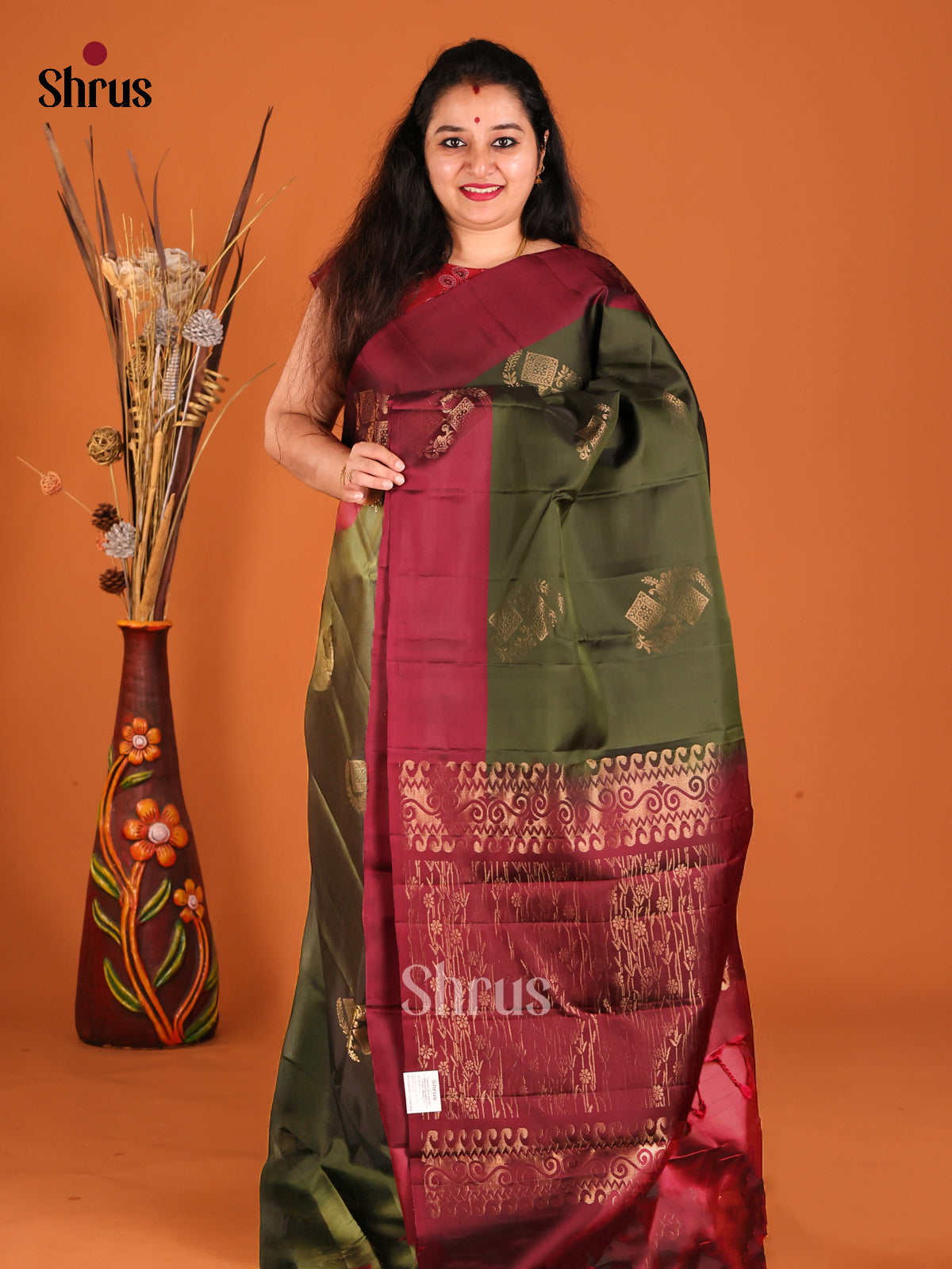 Green & Maroon Softsilk-halfpure Saree gleams with gold zari floral motifs - Shop on Shrus.com