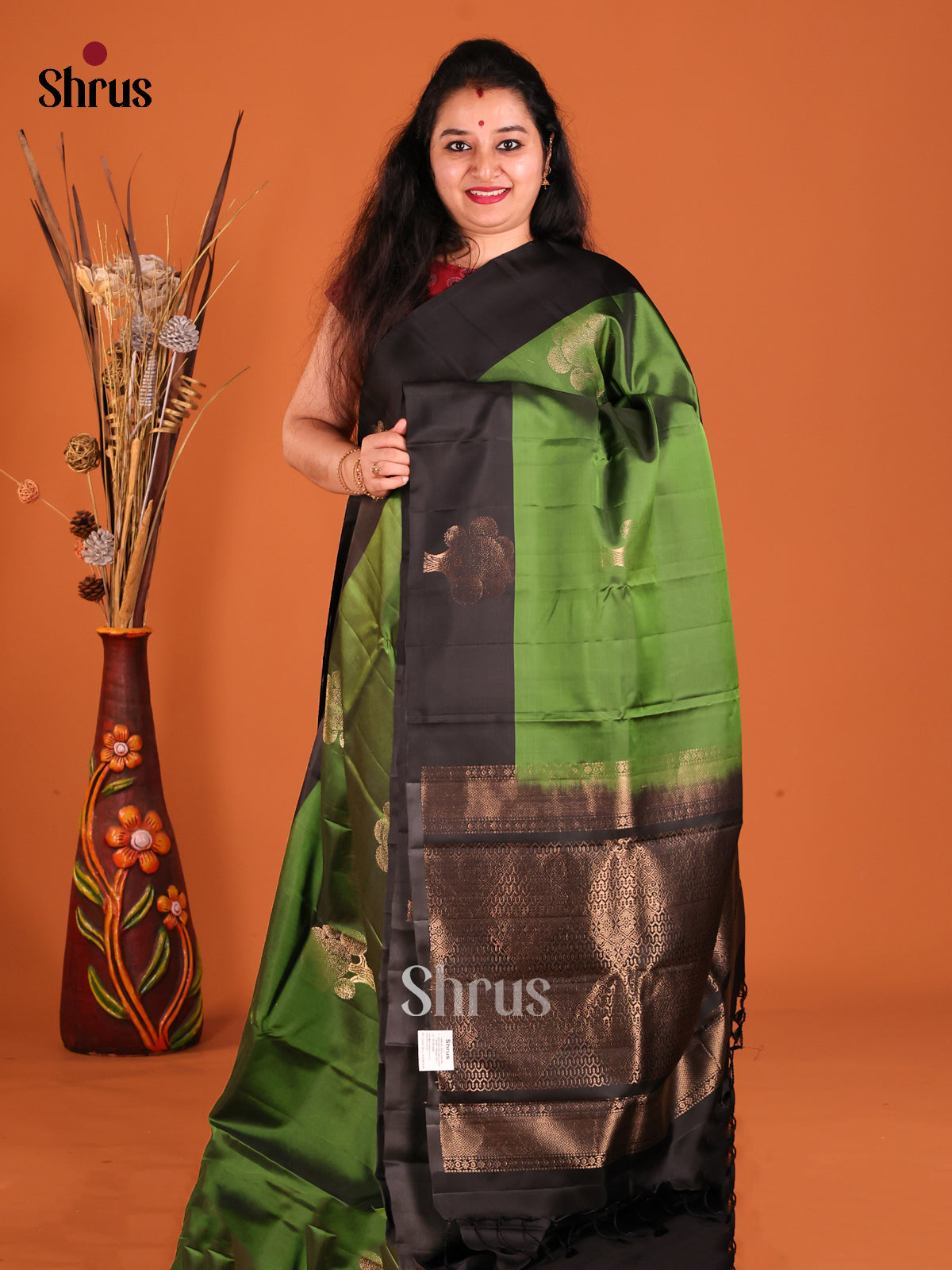 Green & Black Softsilk-halfpure Saree gleams with gold zari floral motifs - Shop on Shrus.com