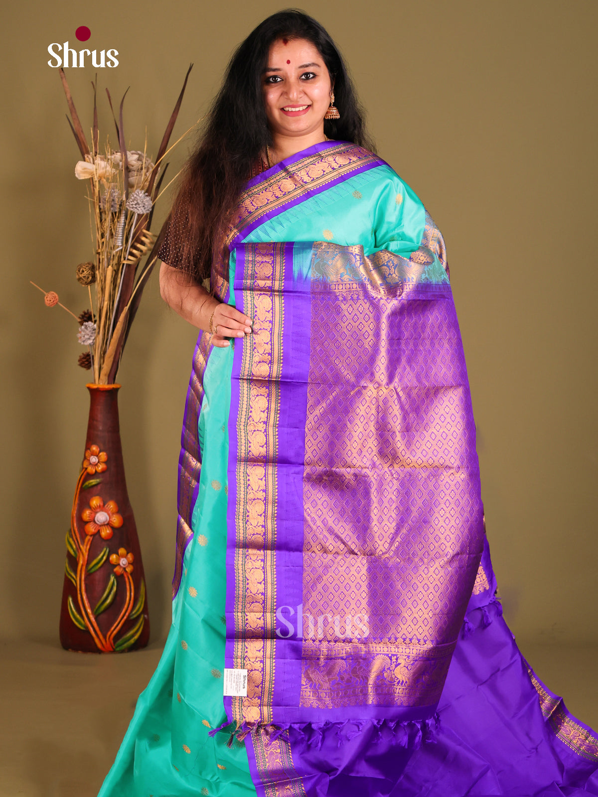 Ornate Teal Gadwal silk Saree with gold zari buttas & Purple Brocade Pallu