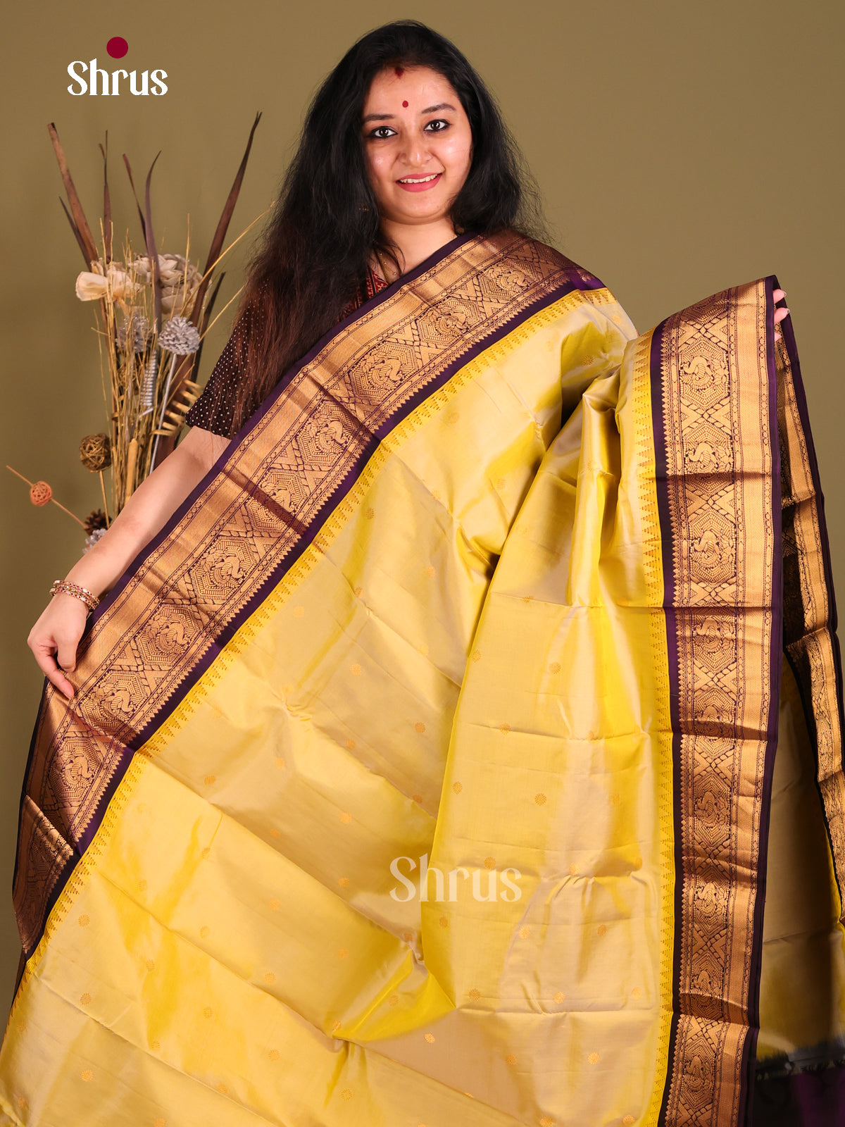 Glamorous Yellow Gadwal silk Saree with Floral Buttas &  Violet zari border - Shop on Shrus.com