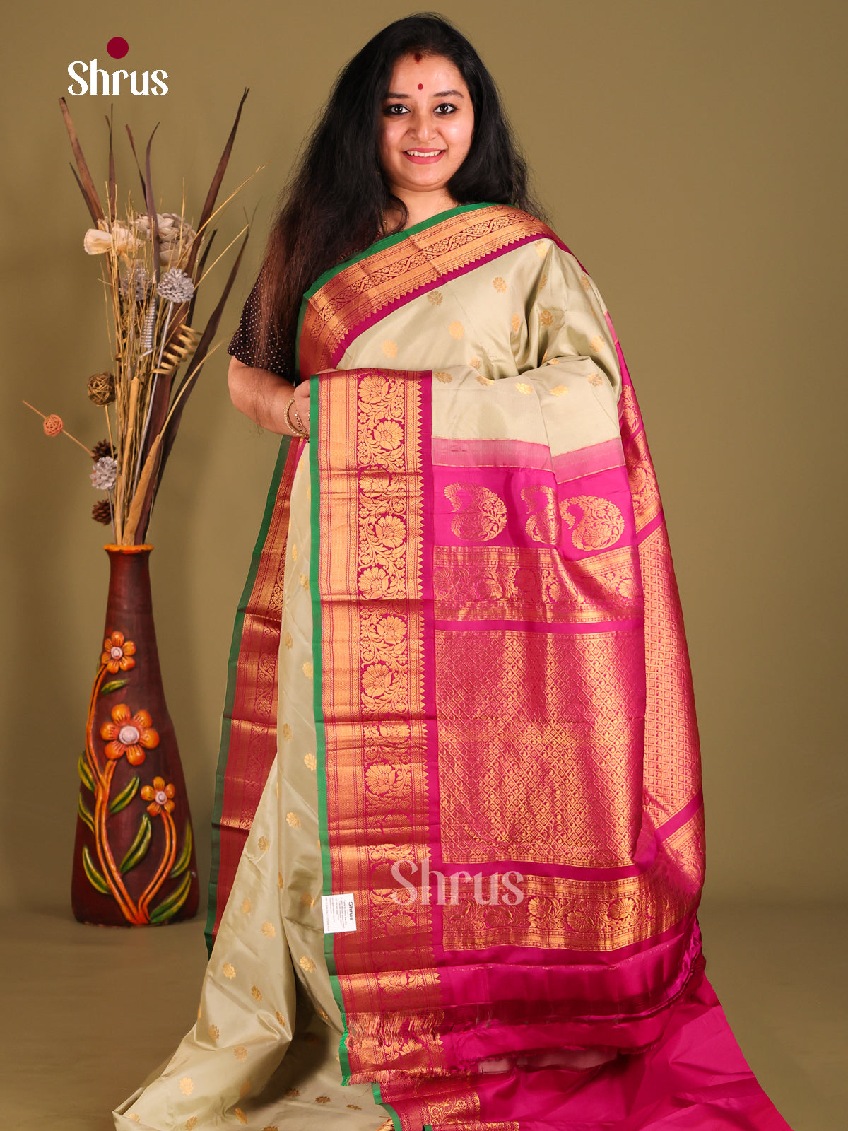 Grey Gadwal silk Saree gleams with gold zari floral buttas