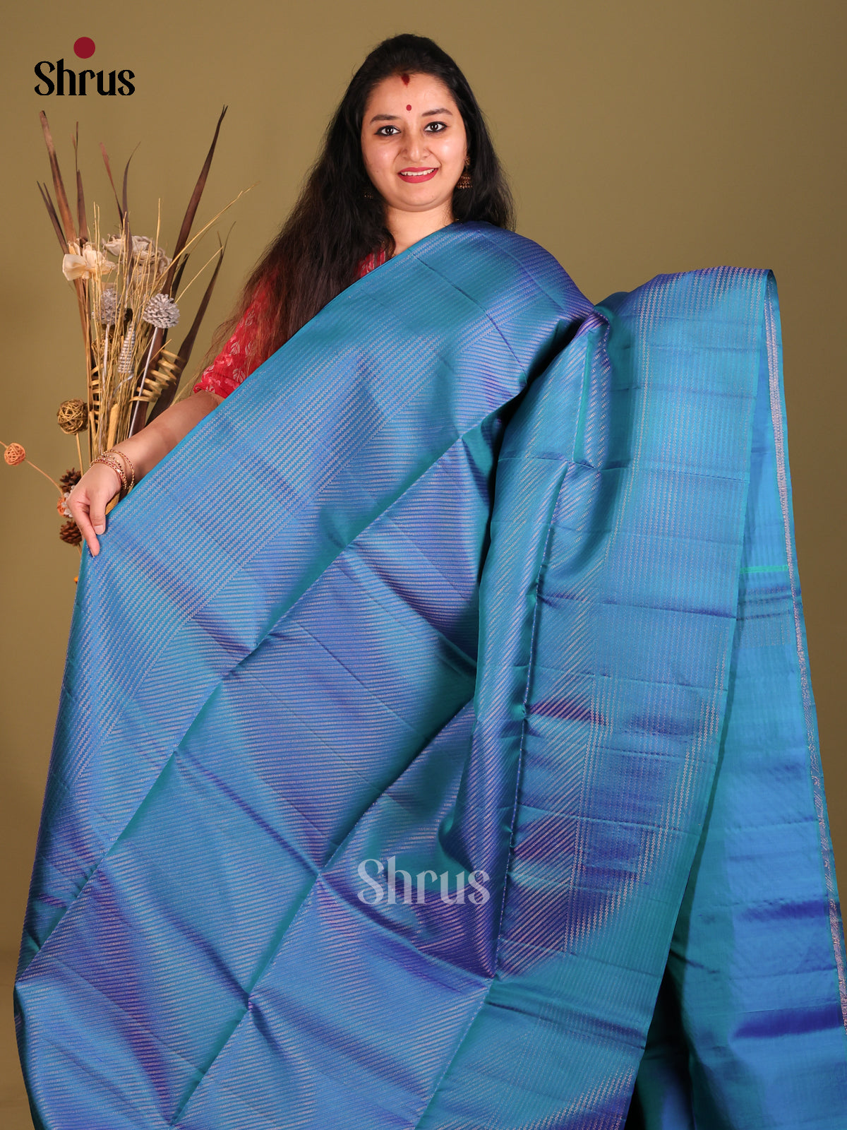 Classy Blue Soft Silk Saree gleams with diagonal zari stripes