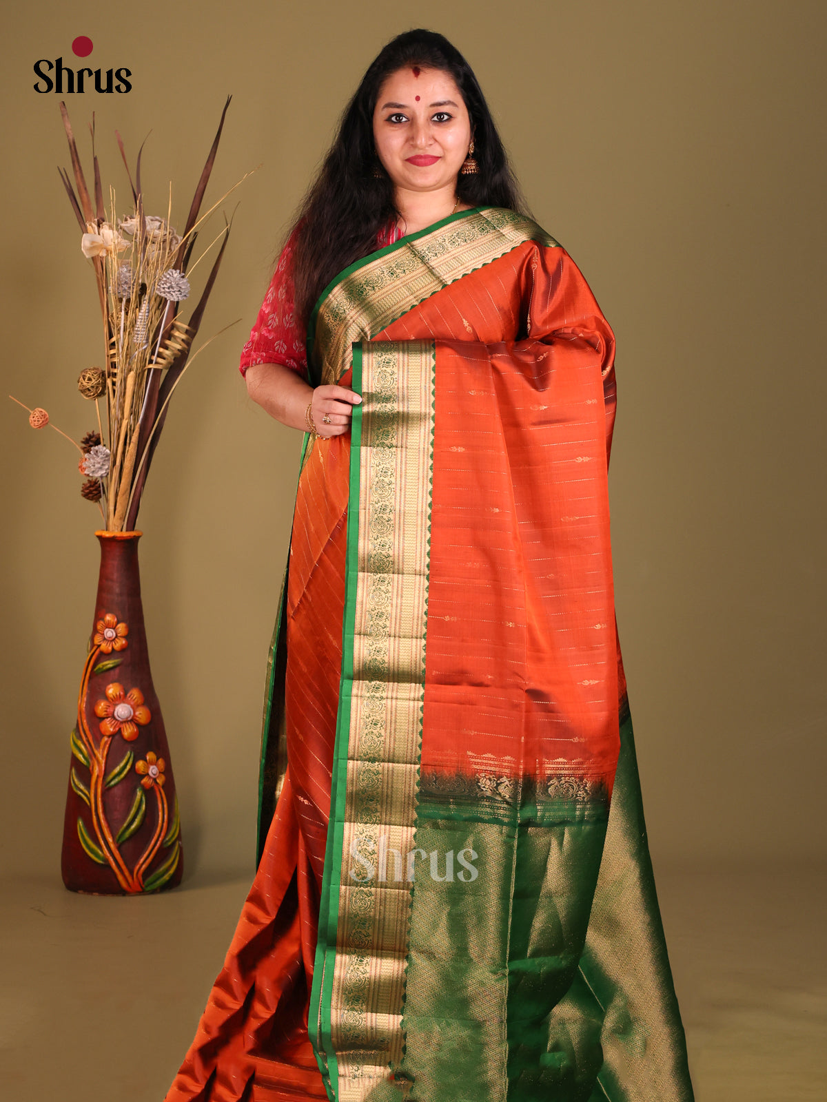 Rust & Green Soft Silk Saree sizzles with zari stripes-1