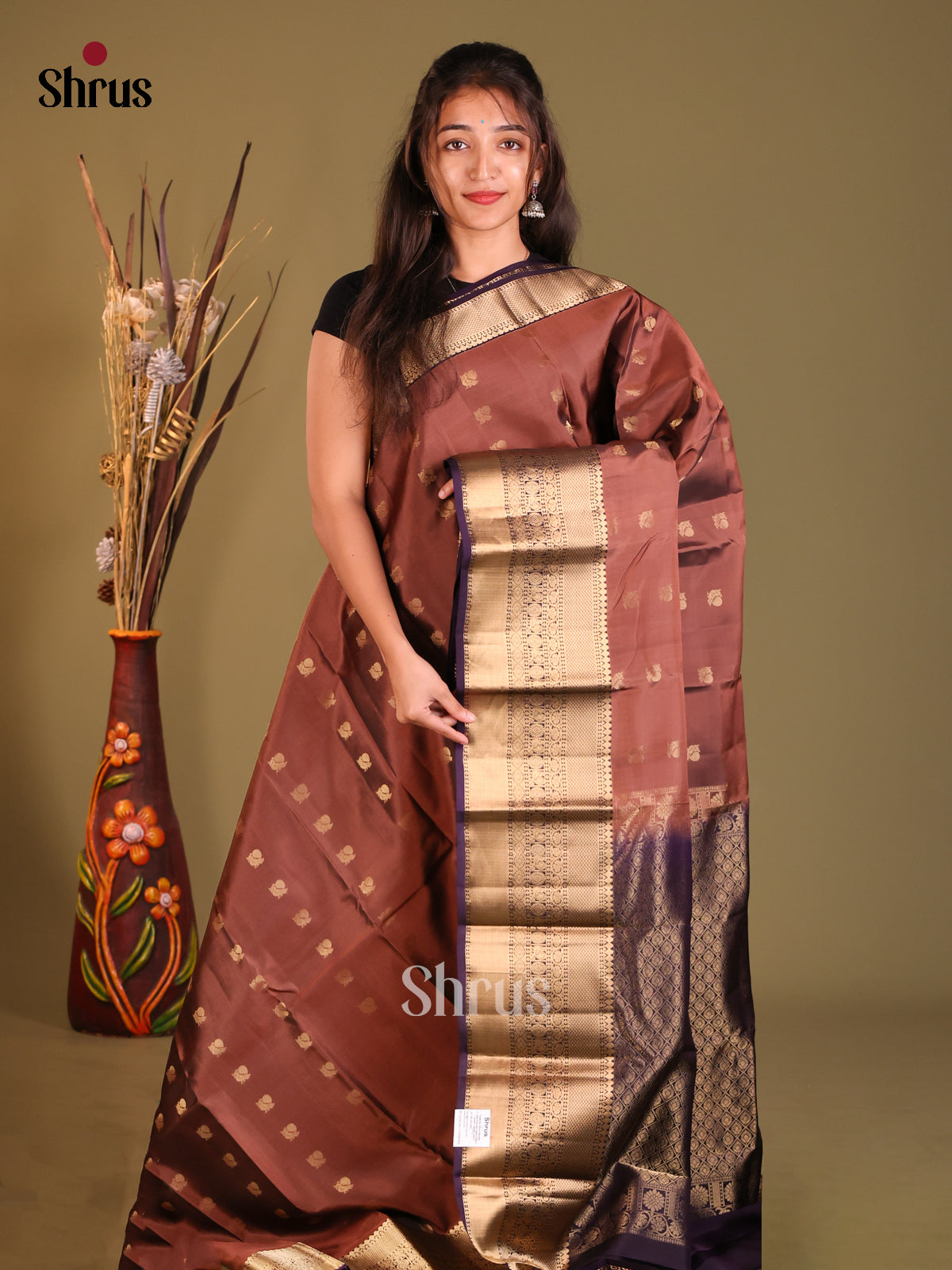 Brown & Violet Softsilk-halfpure Saree gleams with peacock zari buttas