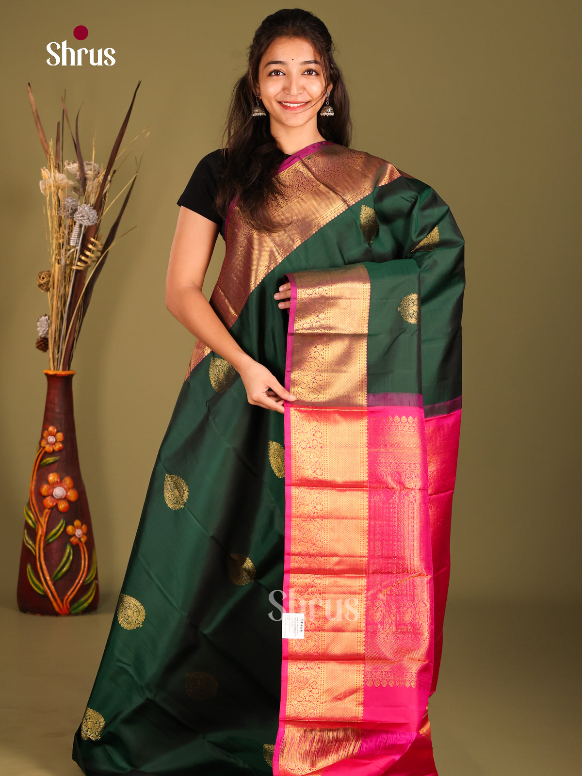 Classy Green Kanchipuram Saree with floral drop motifs & Rich Pink Zari Border