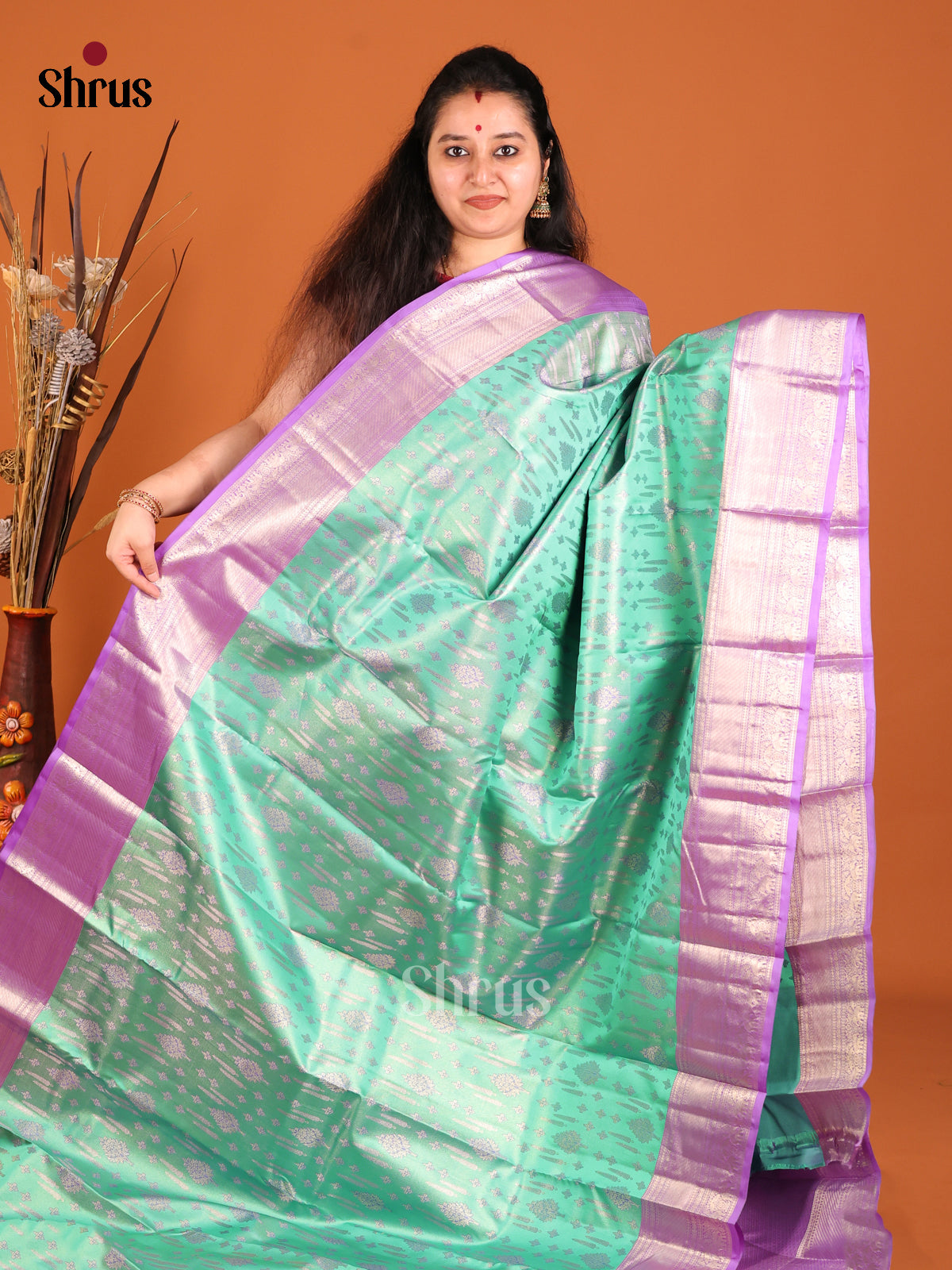 Pista Green & Purple Kanchipuram silk saree gleams with zari floral buttas -1