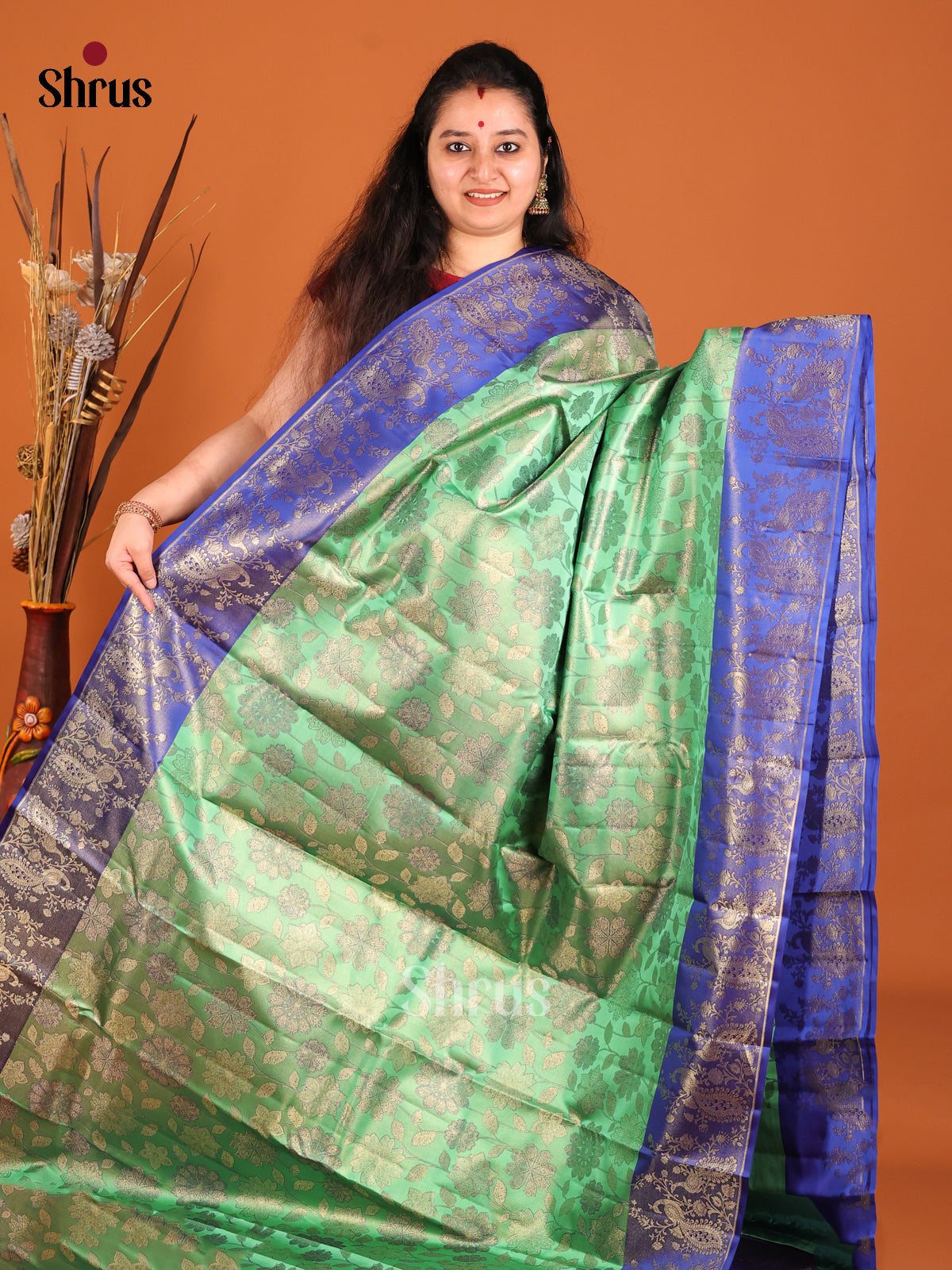 Green & Blue Kanchipuram silk saree with peacock in floral vines zari border - Shop on Shrus.com