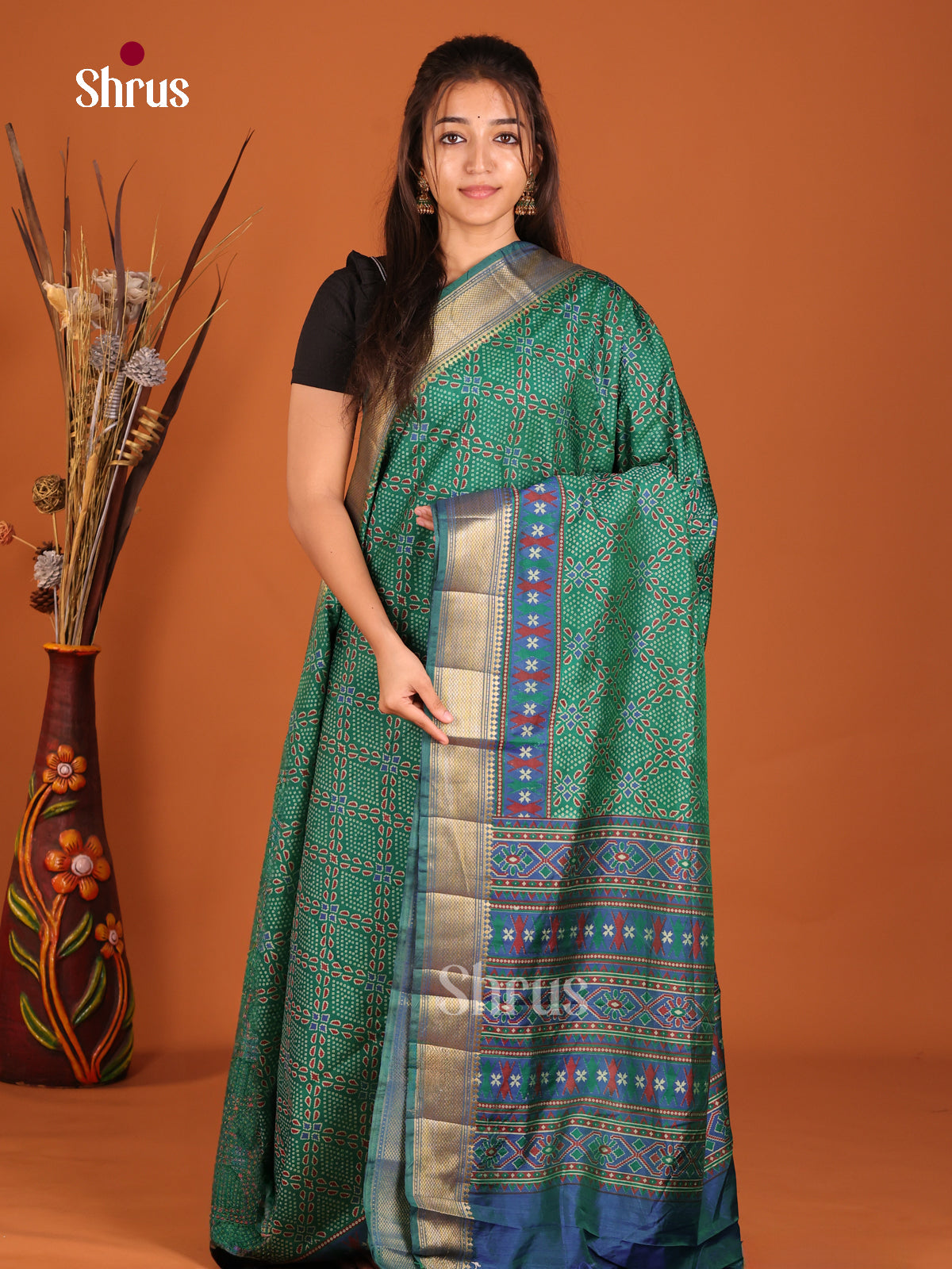 green semi patola saree