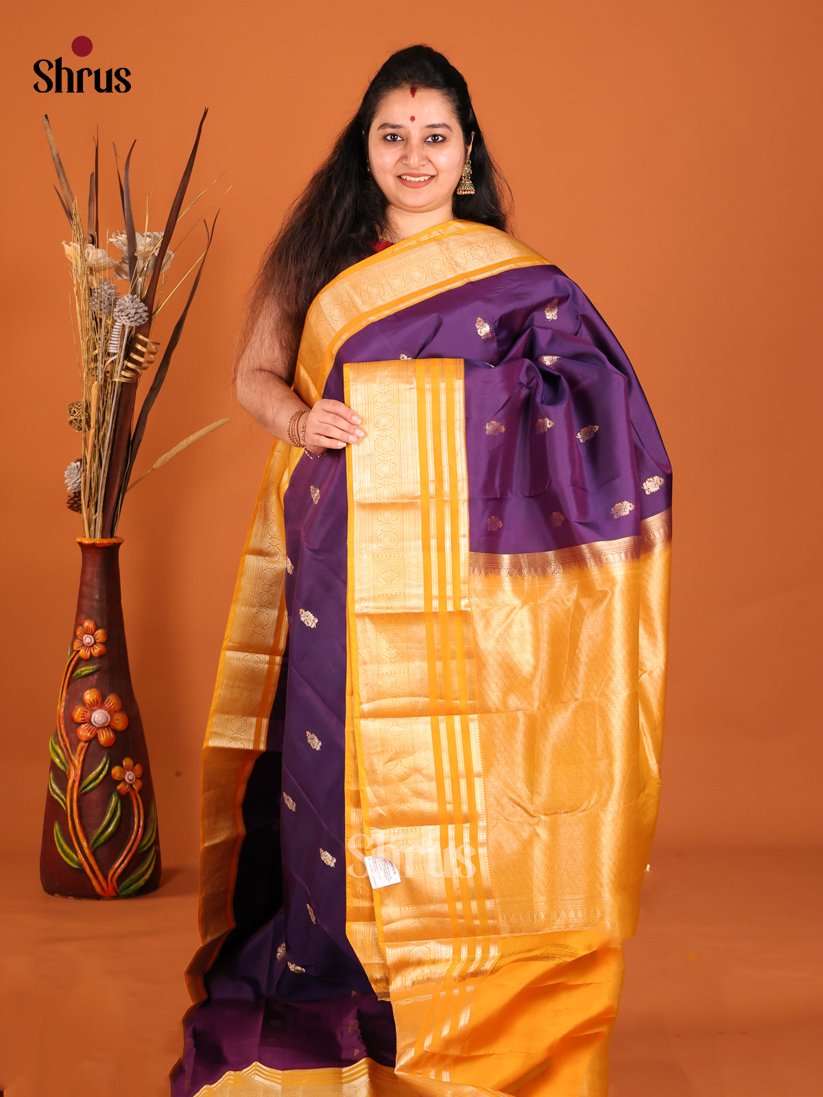 Purple and yellow Kanchipuram Butta design Saree