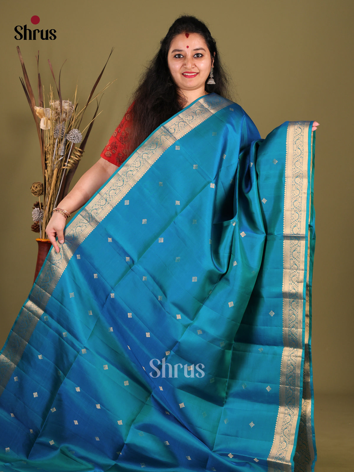 Peacock Blue Soft Silk Saree with floral vines zari border - Shop on Shrus.com