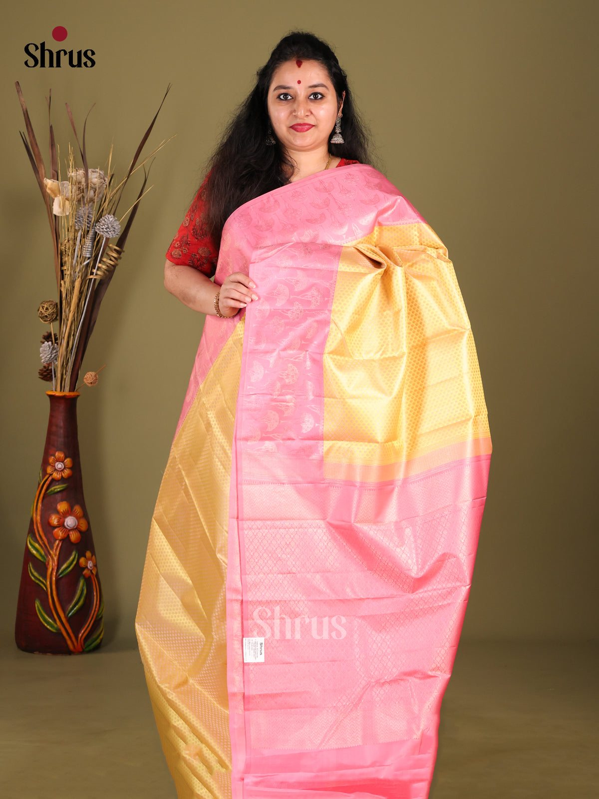 Luminous Yellow Kanchipuram Silk Saree with floral brocade & Pink Zari Border 