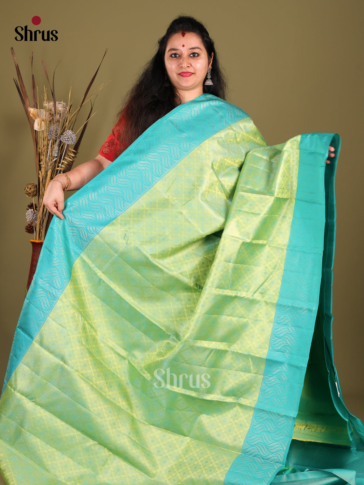 Breezy Light Green Kanjivaram silk Saree with floral nestling brocade & Blue Border -1
