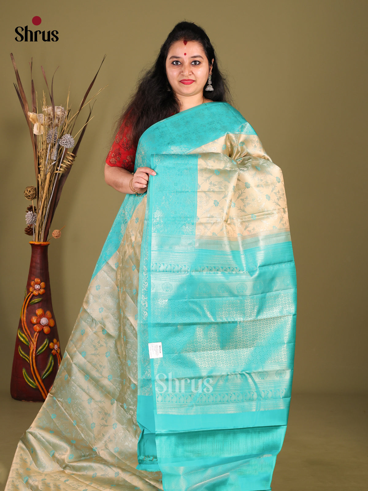 Chic Pastel Green Kanjivaram silk Saree with Floral brocade Body & Sky Blue Border