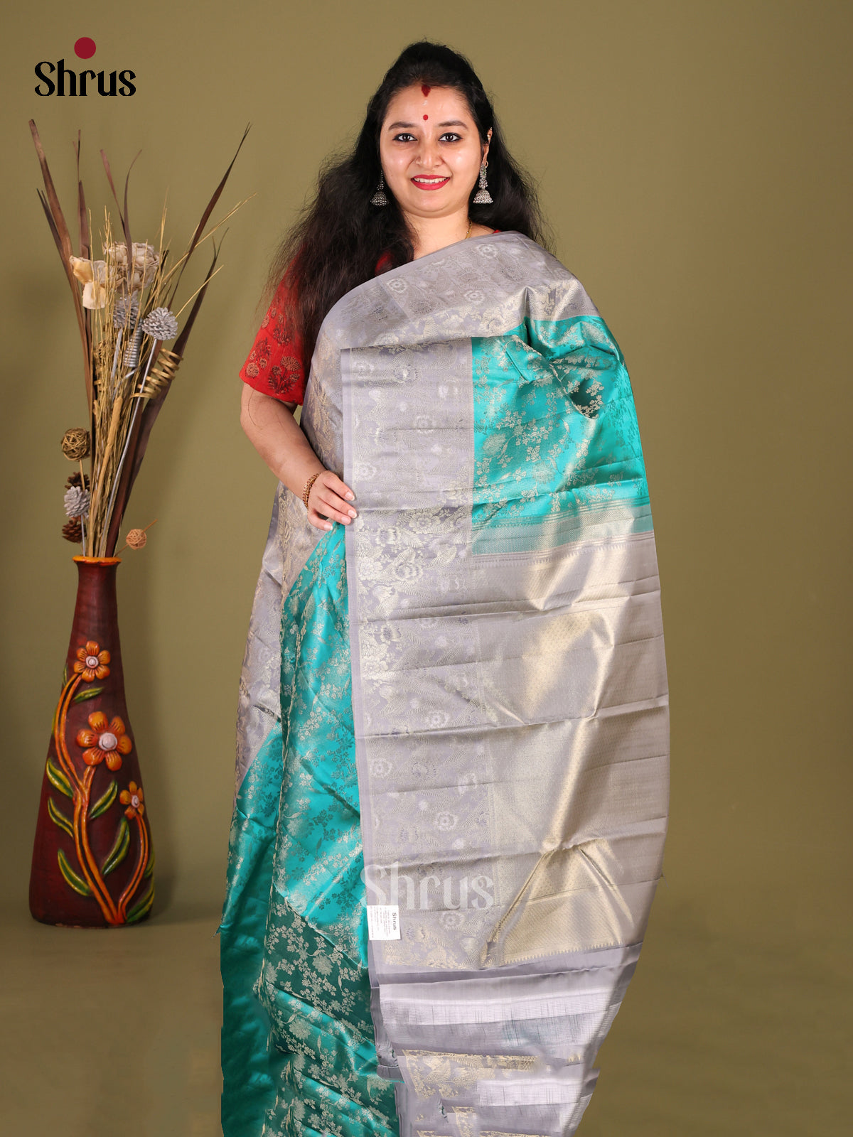 Radiant Sky Blue Kanjivaram silk Saree with floral nestling brocade & Grey Border 
