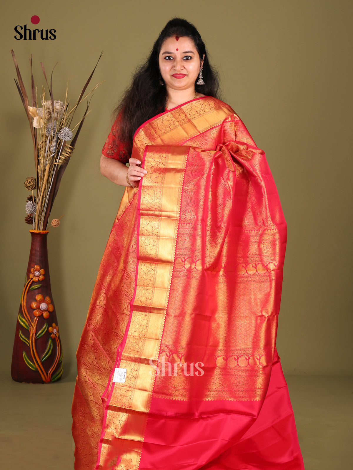 Glorious Red Kanchipuram Saree with Glistening golden zari brocade Body