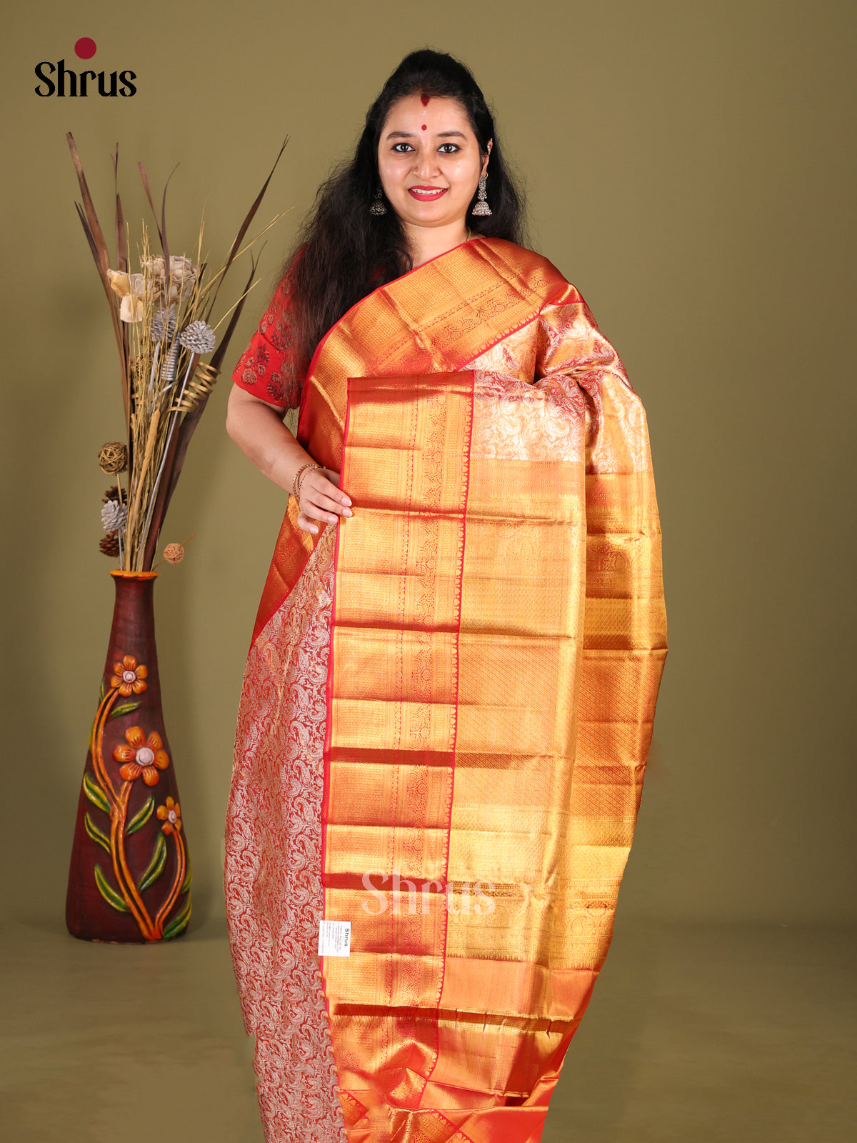Breathtaking Orange Kanchipuram silk Saree with zari Nestling brocade & Red Border 