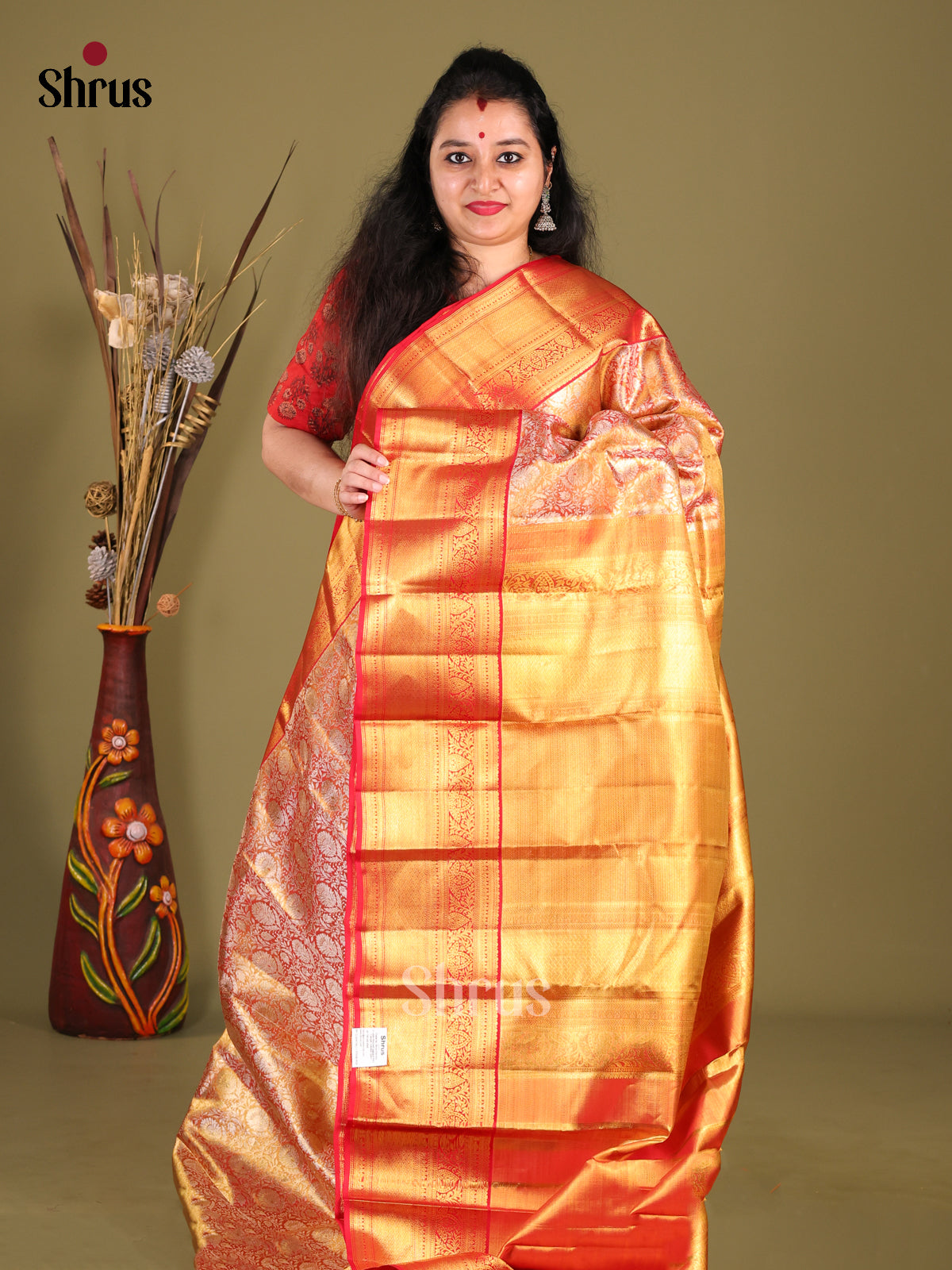 Glimmering Orange Kanchipuram Saree with Floral Brocade & Red Zari Border - Shop on Shrus.com