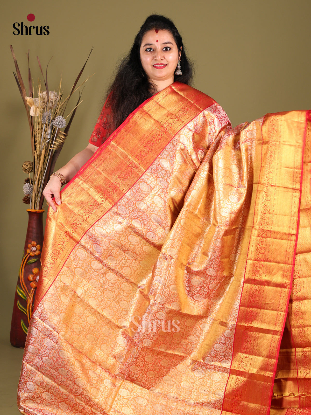 Glimmering Orange Kanchipuram Saree with Floral Brocade & Red Zari Border - Shop on Shrus.com