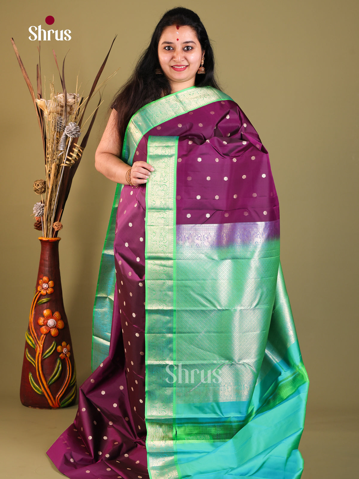 Purple and green Kanchipuram Butta design Saree