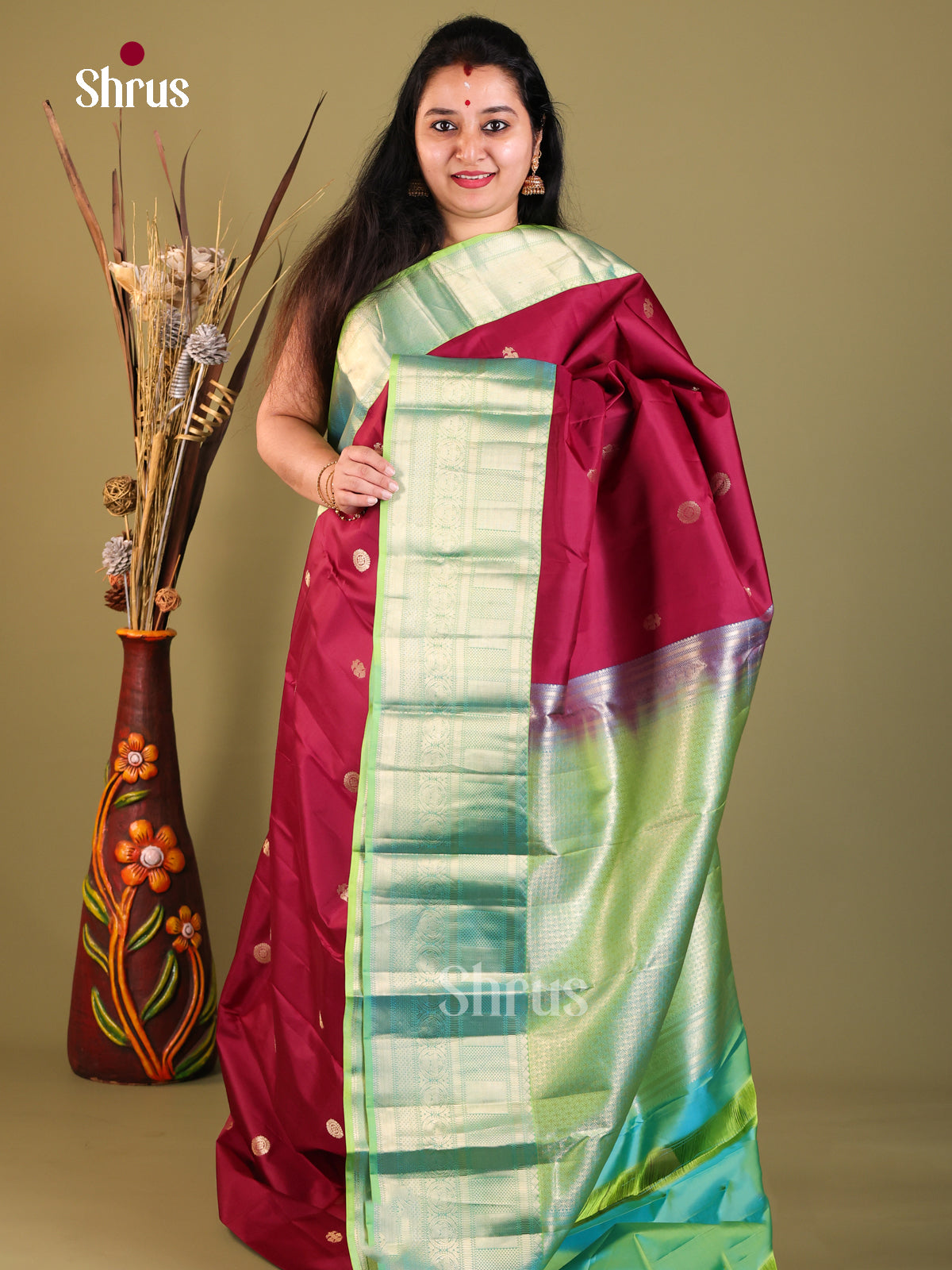 maroon and green Kanchipuram Butta design Saree