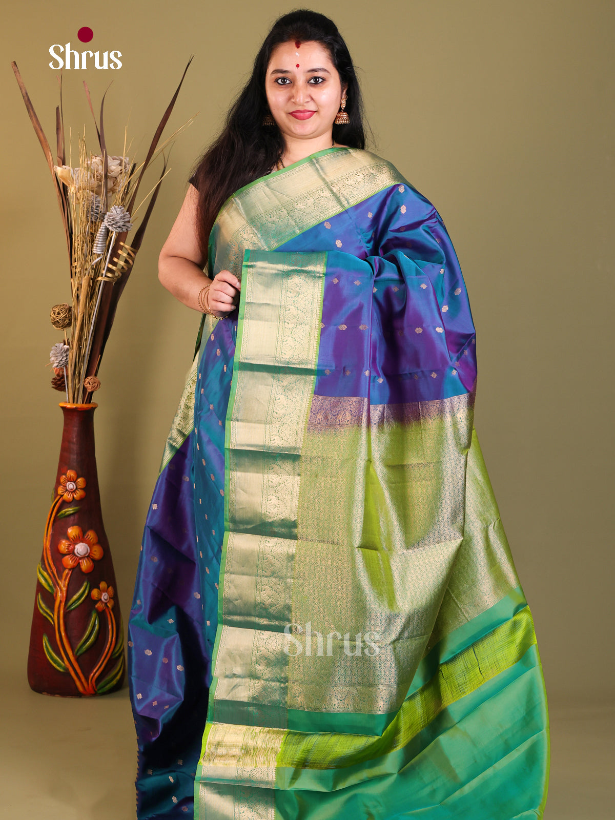 blue and green Kanchipuram Butta design Saree