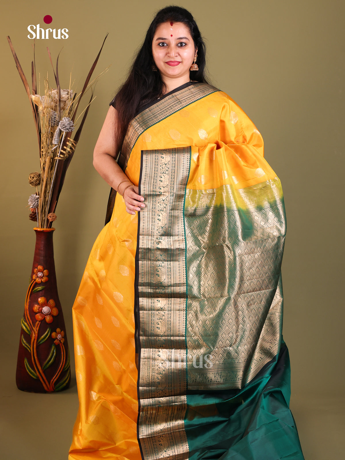 Yellow and green Kanchipuram Korvai Butta Saree