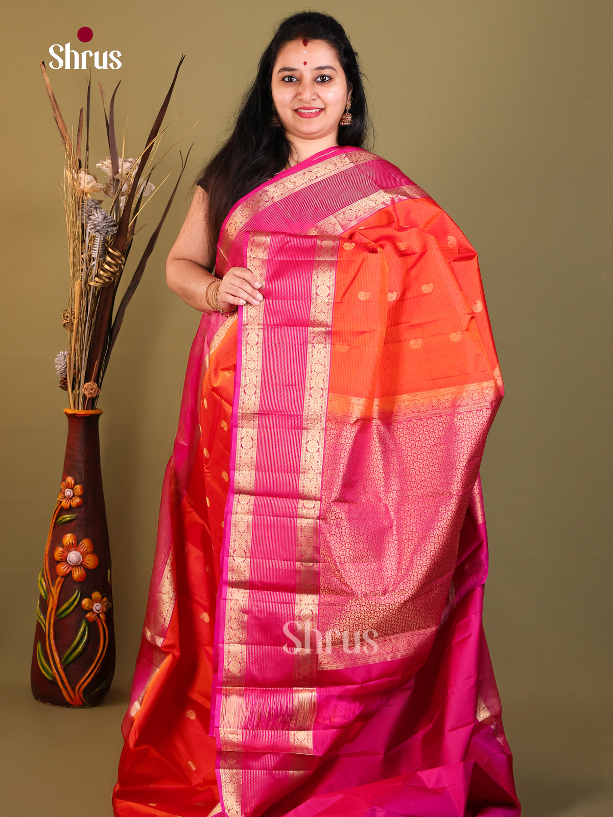 Radiant orange and red  Kanchipuram Butta design Saree
