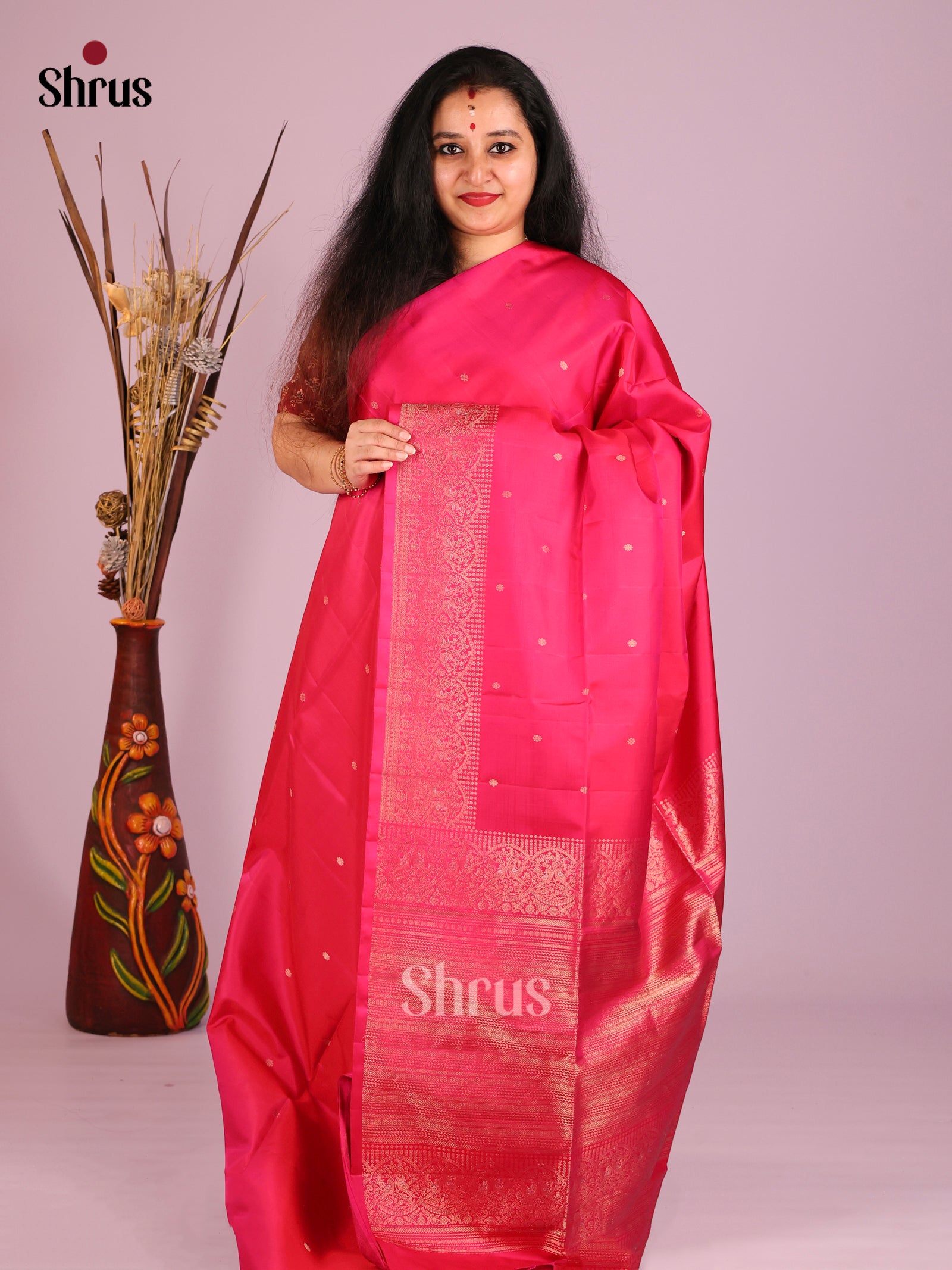 Graceful Pink Soft Silk Saree with Gold Buttas & zari Woven Peacock border 